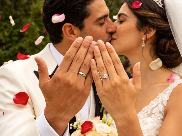 Couple Kissing with Rings Visible