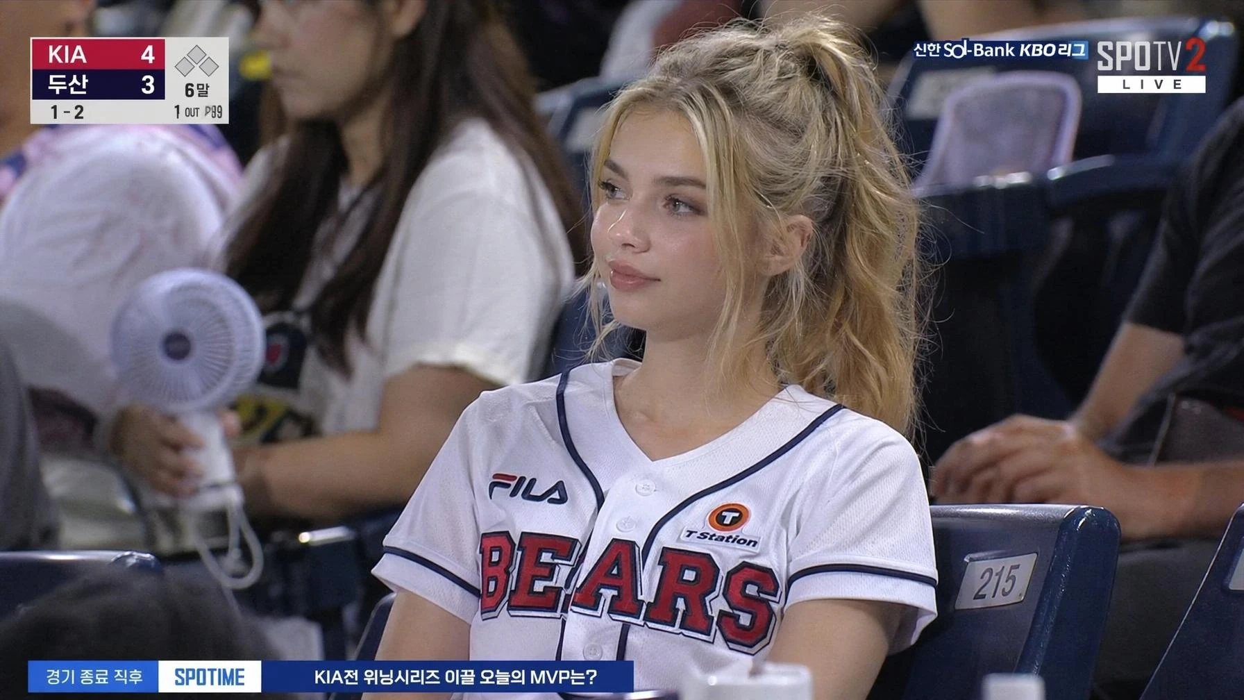 Close-up Korean baseball fan screenshot under night stadium lights