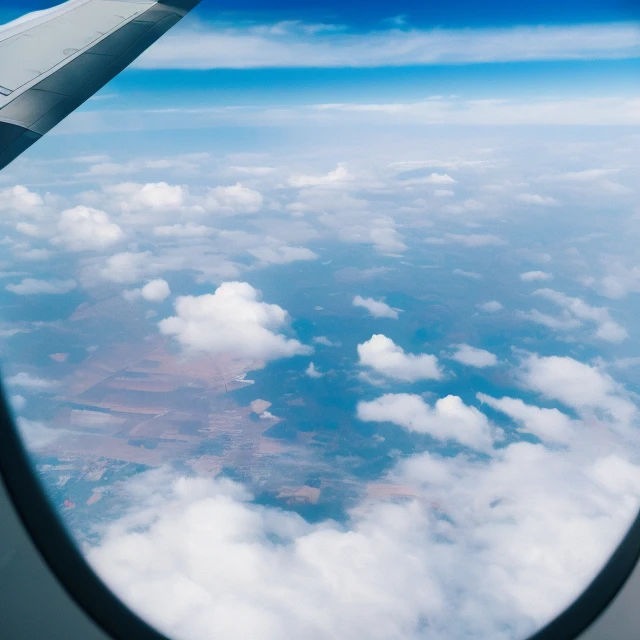view from an ultra high quality plane flying through the clouds,  4k, high definition, beautiful view, [intricate clouds], sun rays shining through the window of the plane