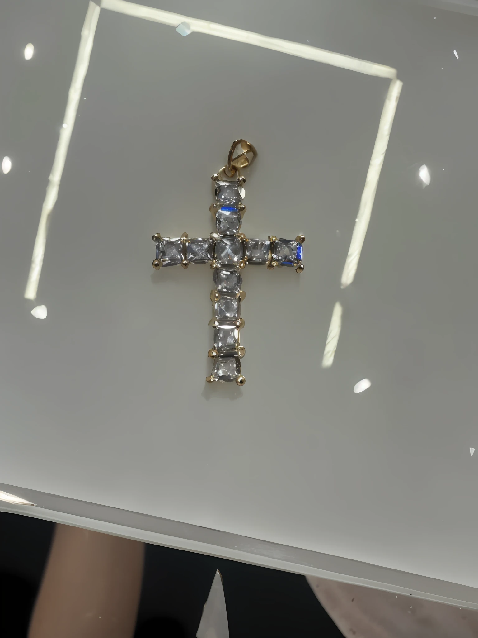 there is a cross made of diamonds on a table, beads cross onbare chest, gold plated, crosses, high angle close up shot, detailed zoom photo, pendant, presidential cross, crucifix, close up shot of an amulet, made of crystal, neon cross, jewlery, holy cross, gold jewerly, high picture quality, ankh pendant