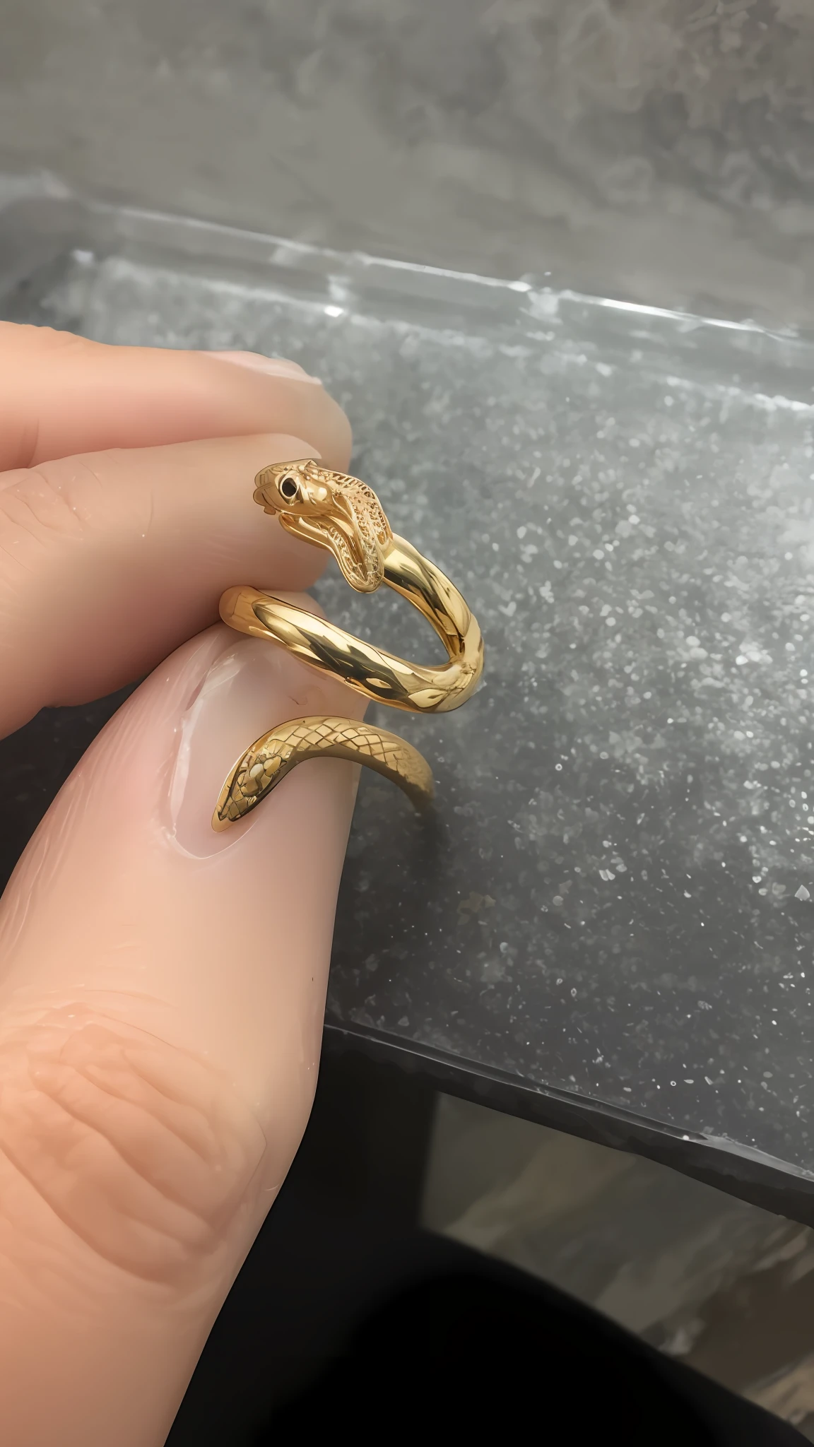 someone is holding a gold ring with a snake on it, gold plated, elden ring inspired, gold rings, added detail, gold jewerly, gold jewelry, gold dripping in spiral, 14k gold wire, gold jewlery, ring, jewelry design, golden snakes, hook as ring, realistic gold, mixed with snake, forked snake tongue sticking out