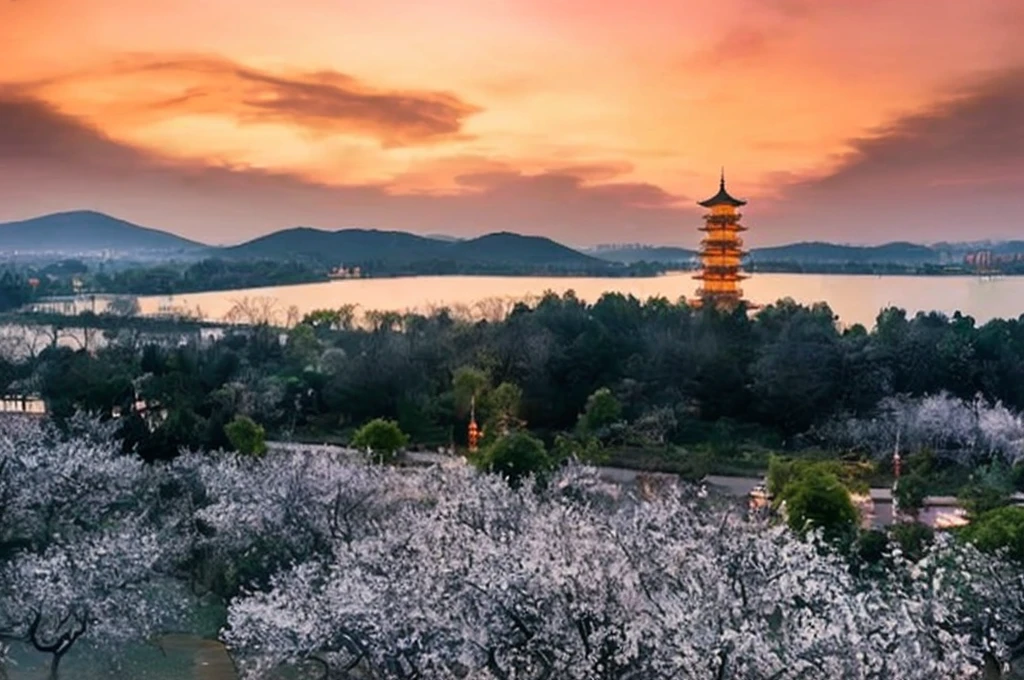 a view of a pagoda tower in the distance with a lake in the foreground, hangzhou, chinese landscape, spring evening, golden hour in beijing, ancient chinese architecture, dreamy chinese town, ancien chinese tower, guangjian, sunset warm spring, pagodas on hills, baotou china, beautiful image, inspired by Li Keran, by Niko Henrichon