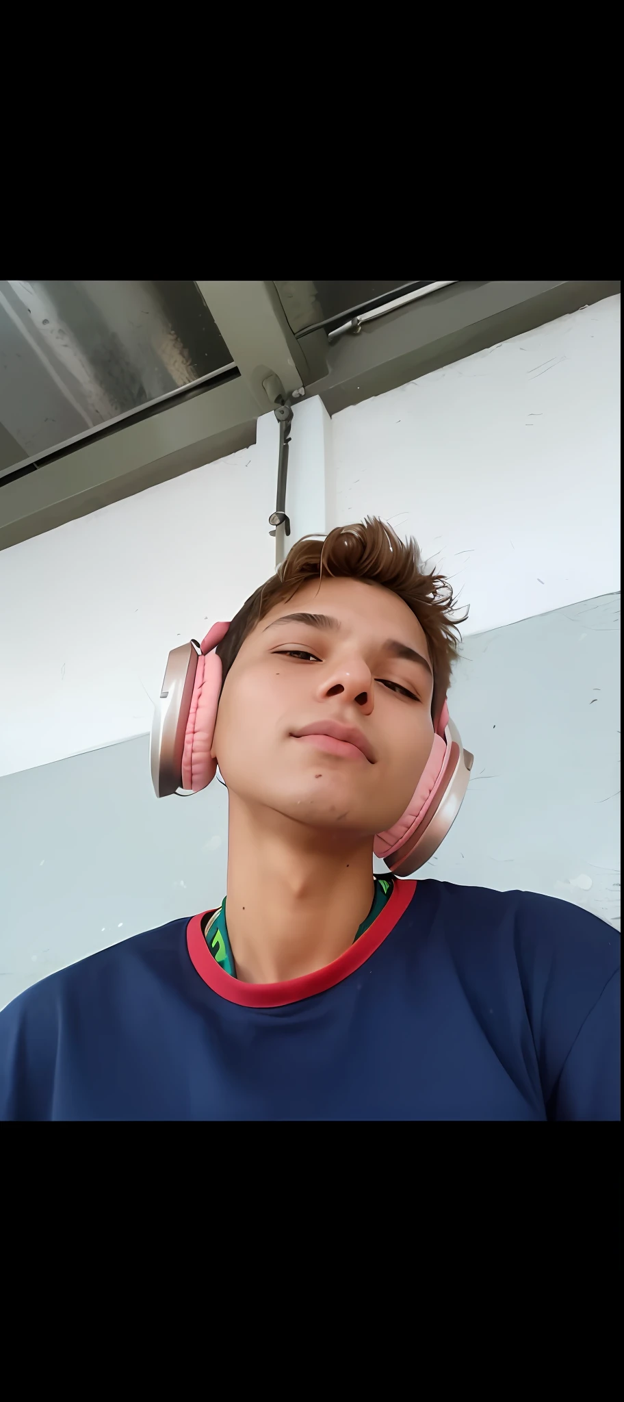there is a young man with headphones on his head, with head phones, with headphones, sousaphones, around 1 9 years old, caio santos, headphones, andres rios, headphones on, wearing headphones, mateus 9 5, profile photo, real sousaphones, by Nándor Katona, very very low quality picture, he has headphones