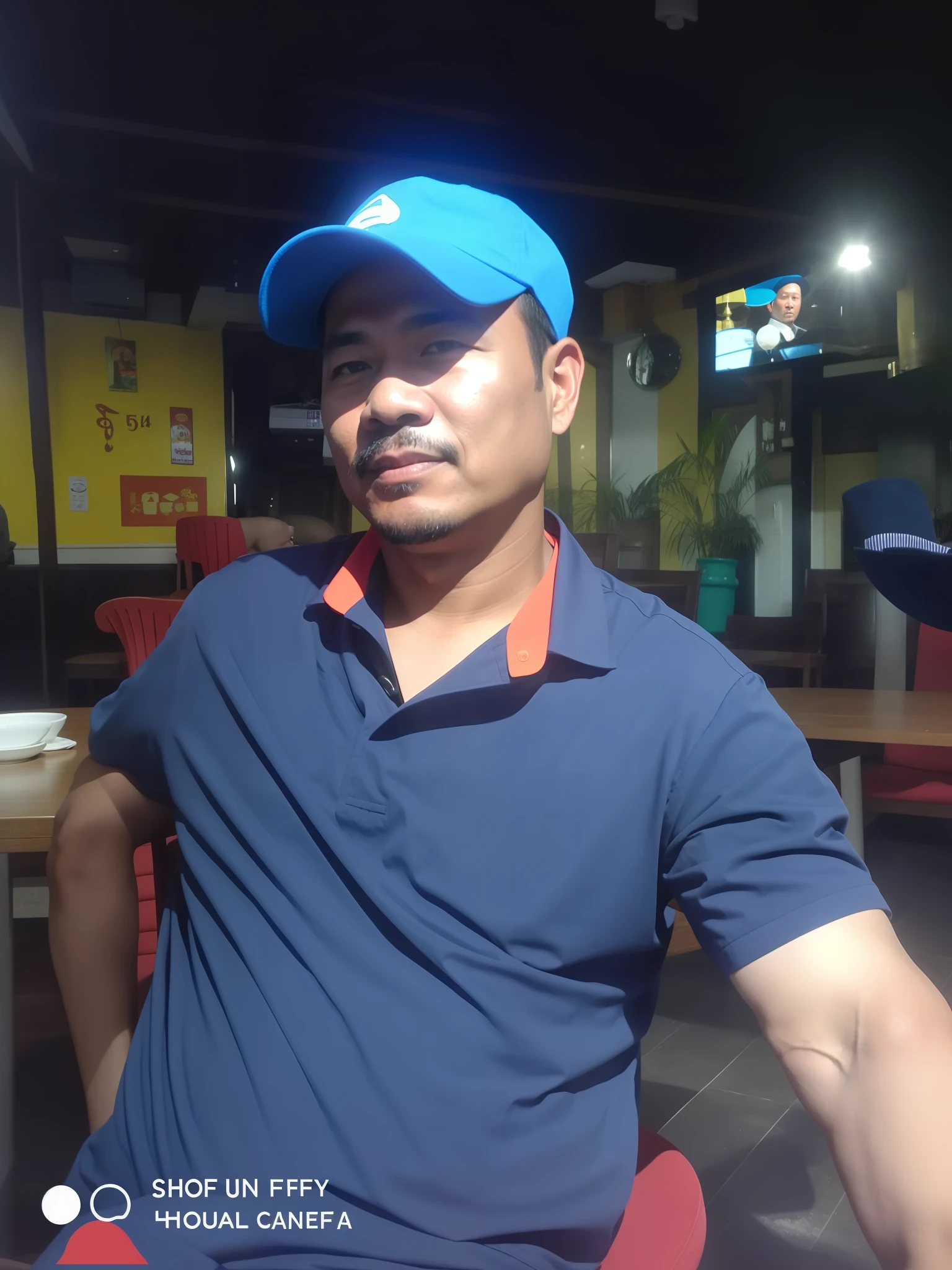arafed man sitting in a chair in a restaurant with a blue hat, 4 0 years old man, hoang long ly, 5 0 years old man, dang my linh, thawan duchanee, nuttavut baiphowongse, nivanh chanthara, patiphan sottiwilaiphong