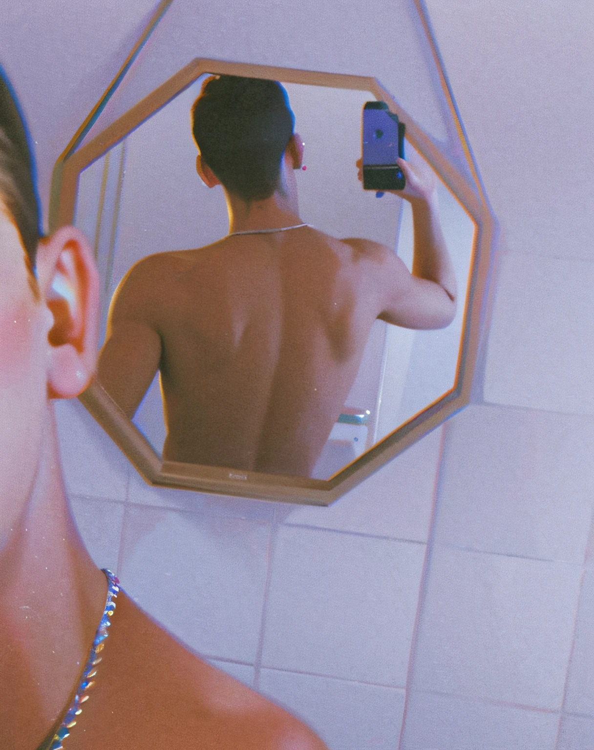 There's a man taking a picture of himself in the mirror, Petra Collins style, seen from behind the mirror, with his back turned, back, back to back, back to camera, back to camera, aesthetics!!!!!!!!, facing camera, facing camera, aesthetics y 2K