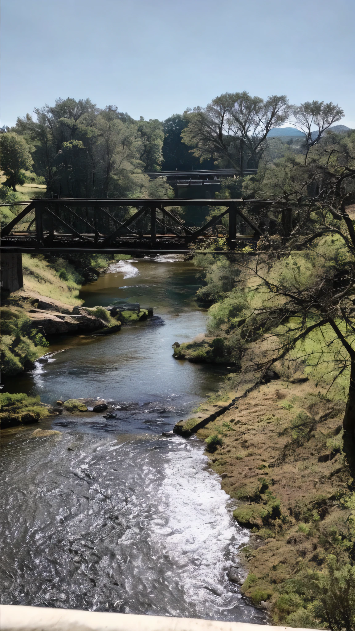there is a bridge over a river with a bridge in the background, river with hanging floor plans, bridge tied in the local river, small river, river running through it, with a river running through it, river running through the middle, the river is flowing its way, river with stunning water, river in the background, panoramic view of the river, Sky with clouds