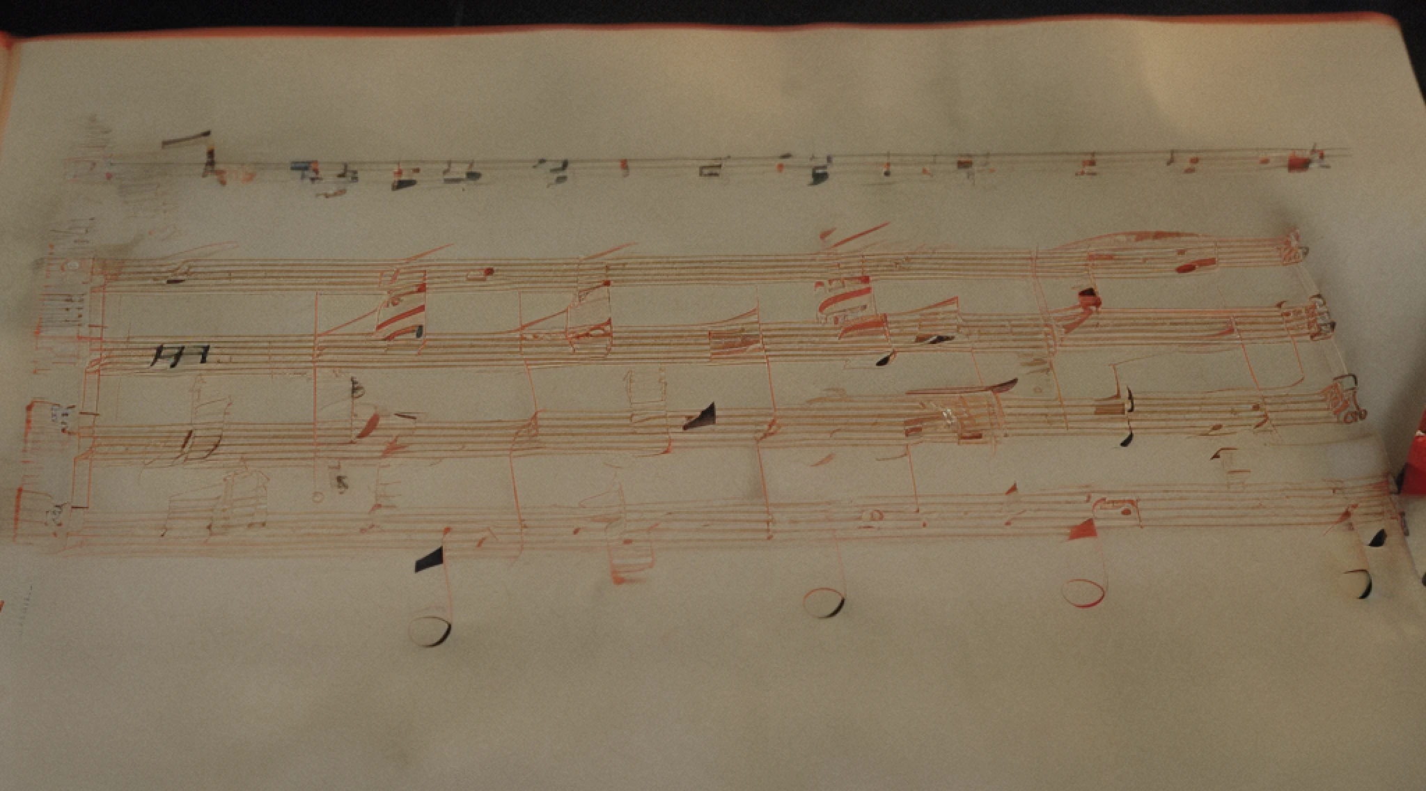 classicnegative photo, close-up of a sheet of music with notes on it, old manuscript, composition on the right side, sheet music, master composition!!!, sheet music written in red paint, sheet music written in red pen, composer, highly detailed composition, manuscript, old script, master composition, on paper, musician, full-volume composition, old parchment inspired by Girolamo Muziano, on old parchment, fantasy, 1970s dark fantasy movie, haze, halation, bloom,  dramatic atmosphere