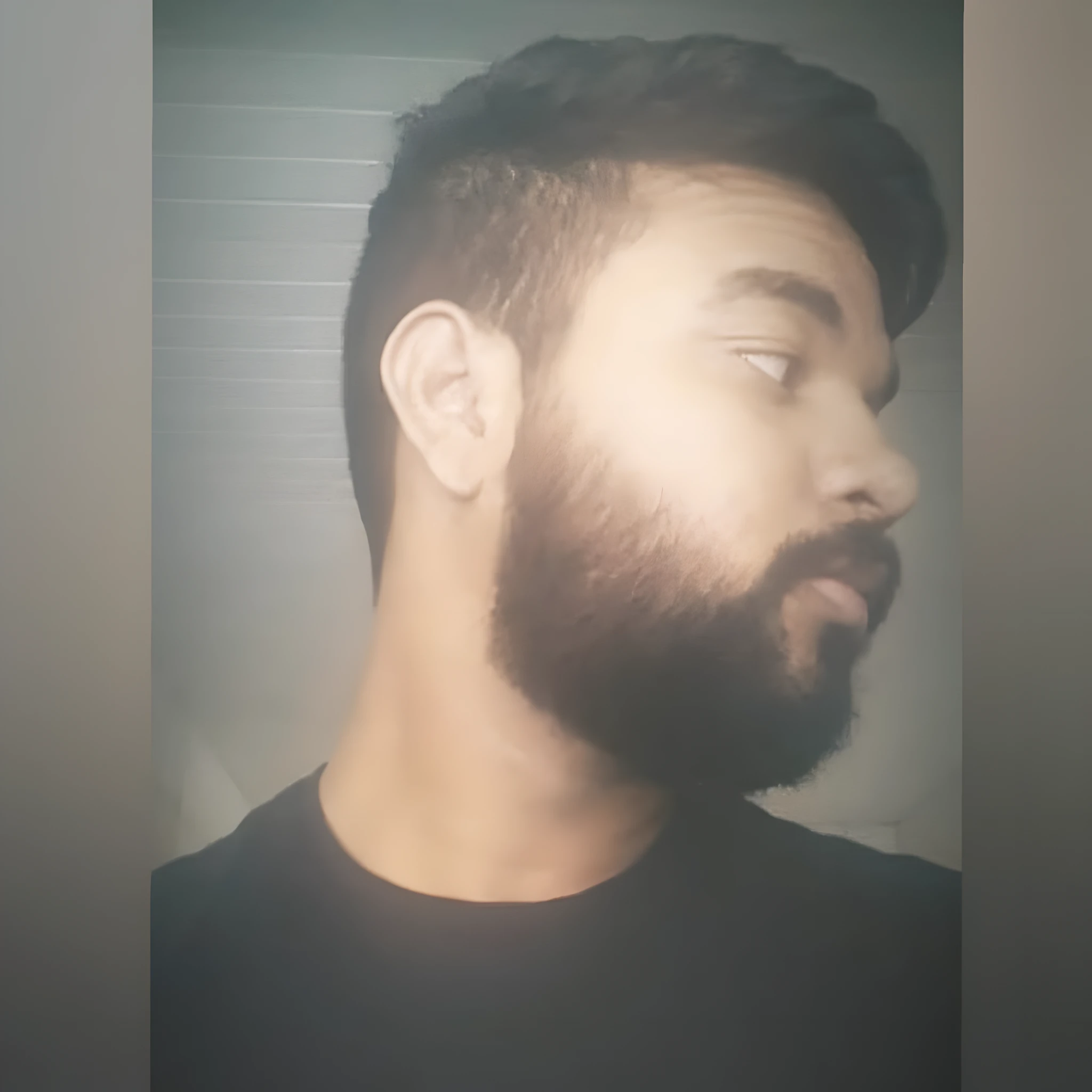 there is a man with a beard and a black shirt, short beard, with a small beard, with a full black beard, small beard, short scruffy beard, shadow of beard, without beard, thin beard, one side haircut, neat beard, shaved beard, thick beard, some beard, full beard, portait photo profile picture