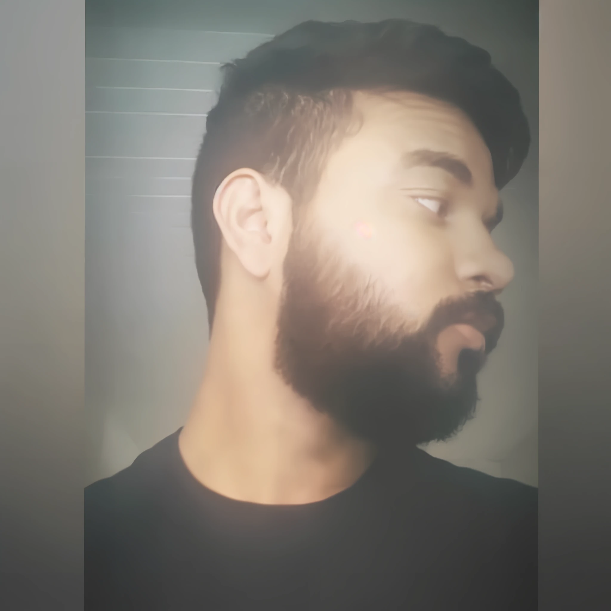 there is a man with a beard and a black shirt, short beard, with a small beard, with a full black beard, small beard, short scruffy beard, shadow of beard, without beard, thin beard, one side haircut, neat beard, shaved beard, thick beard, some beard, full beard, portait photo profile picture