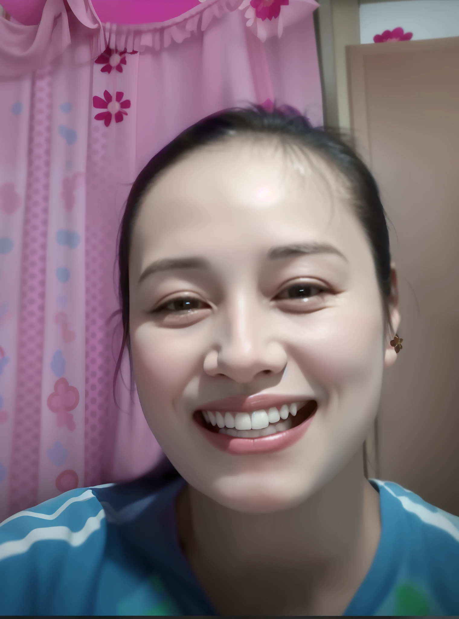 smiling woman in blue shirt with pink curtains in background, 30 years old woman, 3 0 years old woman, she expressing joy, she is smiling and excited, selfie of a young woman, without makeup, she is smiling, low quality video, face showing, she is smiling and happy, ayahausca, imane anys, with round face