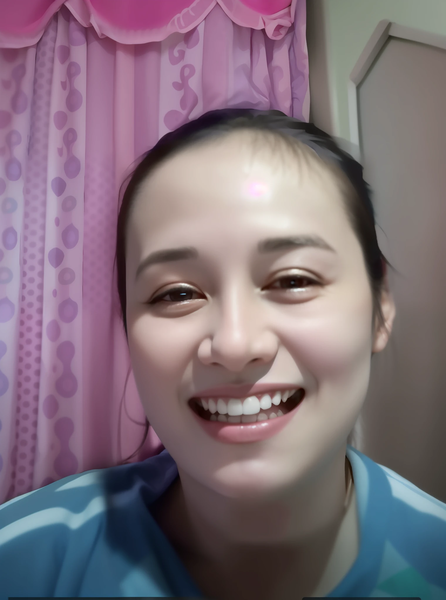 smiling woman in blue shirt with pink curtains in background, 30 years old woman, 3 0 years old woman, she expressing joy, she is smiling and excited, selfie of a young woman, without makeup, she is smiling, low quality video, face showing, she is smiling and happy, ayahausca, imane anys, with round face