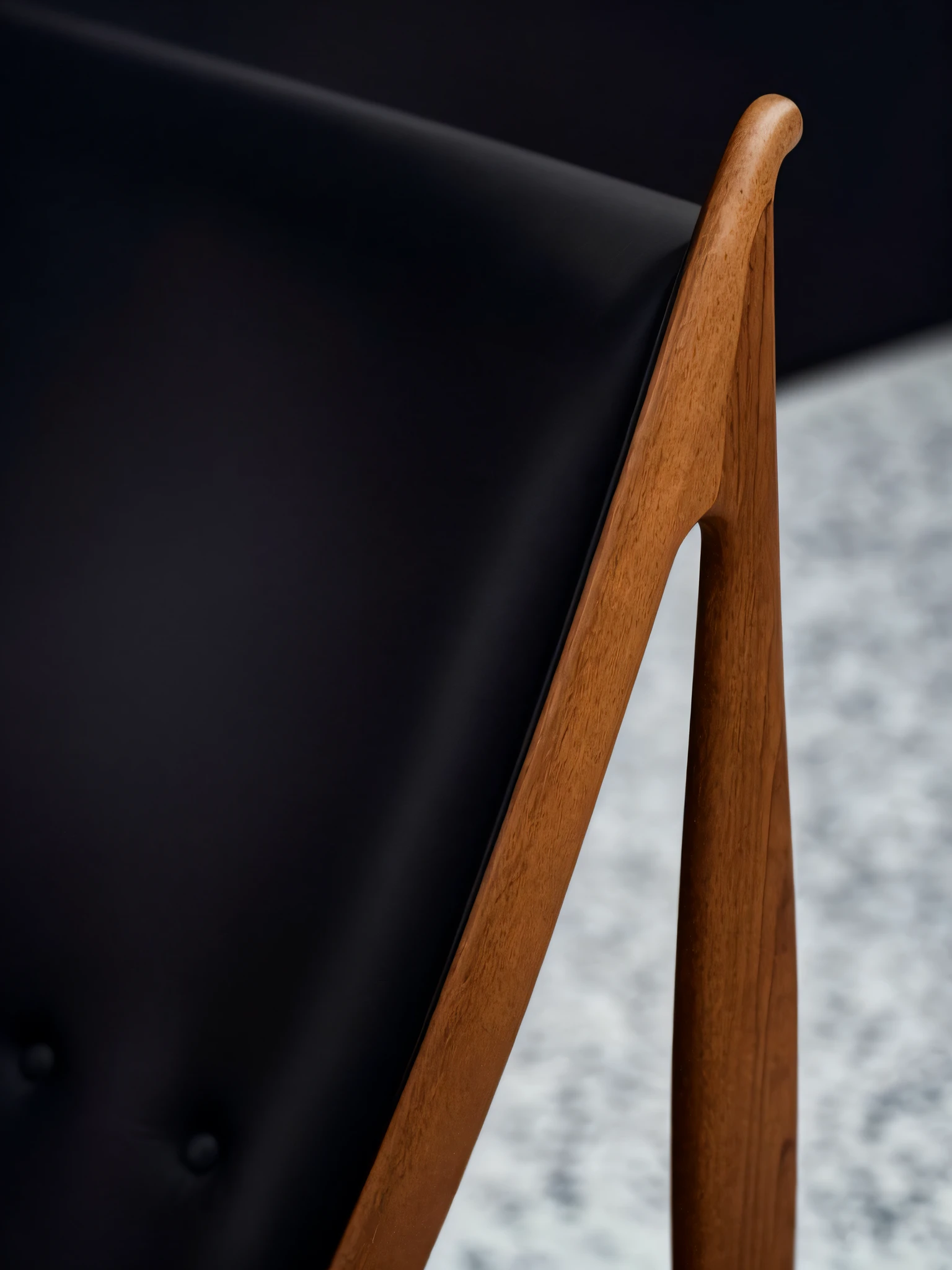 there is a black leather chair with a wooden frame, exquisite and smooth detail, ultra-high details, ultra - high details, 6 0 s chair, stunning detail, detailed zoom photo, super detailed image, 4k detail, 4 k detail, blurred detail, perfect detail, smooth tiny details, niels otto møller, insanely detail, ultra-detail