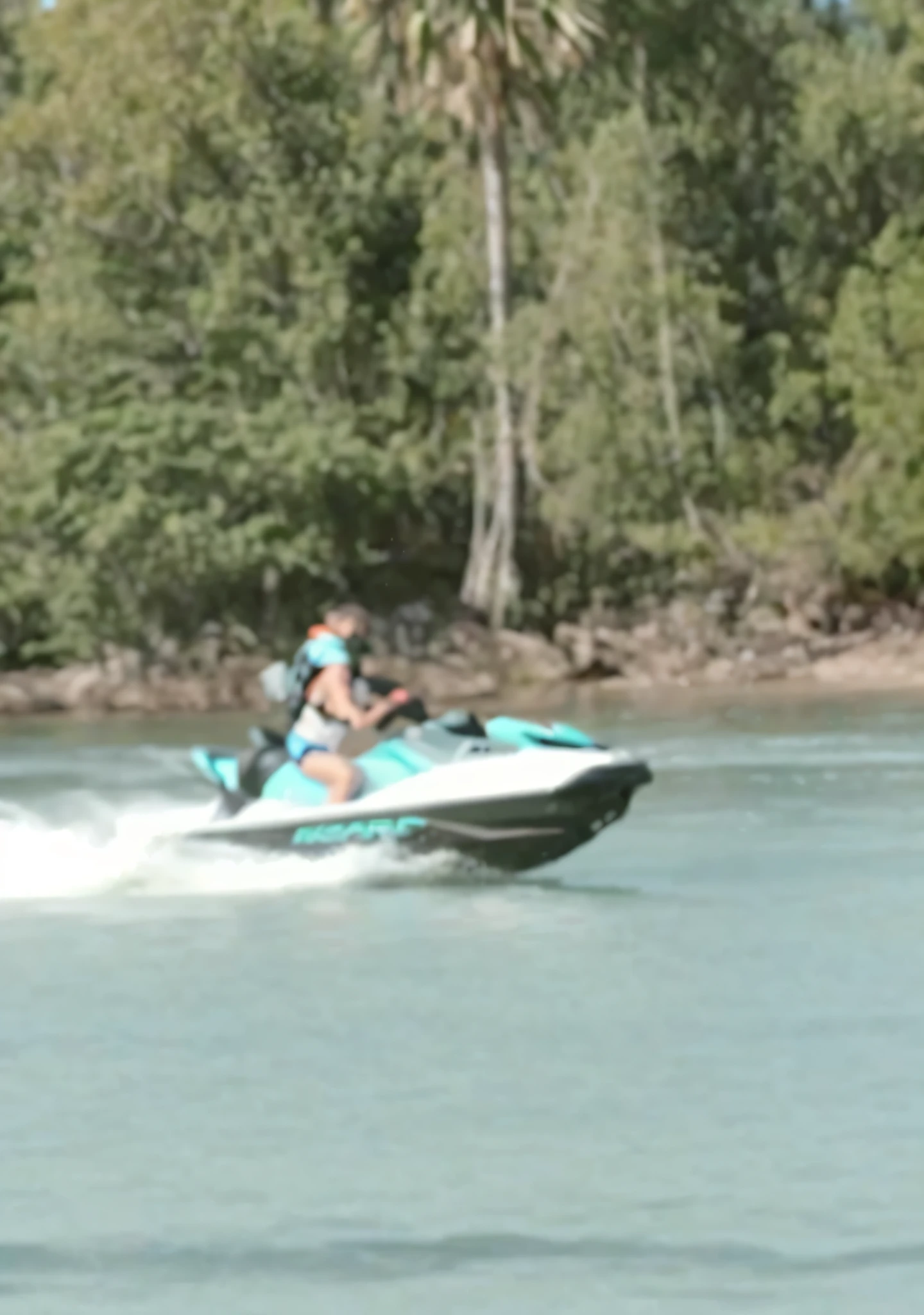 there is a man riding a jet ski on the water, sea - doo gtx, blurry footage, low quality footage, grainy footage, reddit post, having a great time, leaked footage, youtube video screenshot, wonderful scene, screen capture, zoomed out shot, 4 0 9 6, having a good time, on a lake, perfect scene, having fun