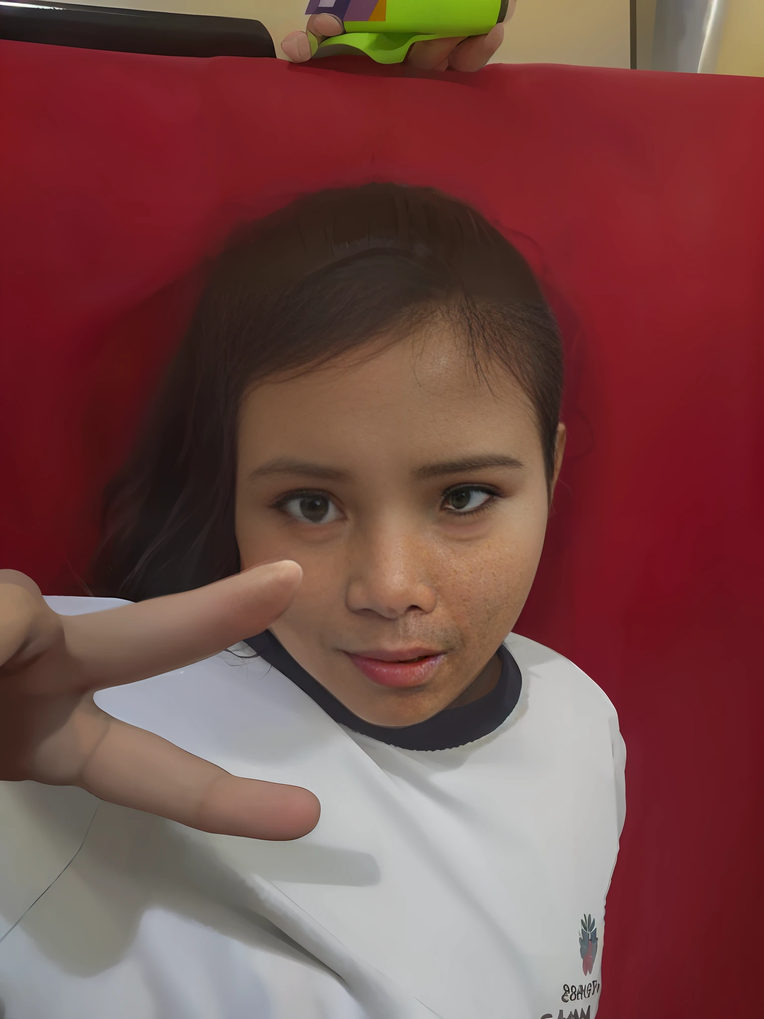 there is a young girl making a funny face while holding her hand up, pointing at the camera, Por Reyna Rochin, giving the middle finger, foto realista, wave a hand at the camera, dedo do meio, em pose de luta, imagem frontal, you g face, com o dedo indicador, giving a thumbs up to the camera