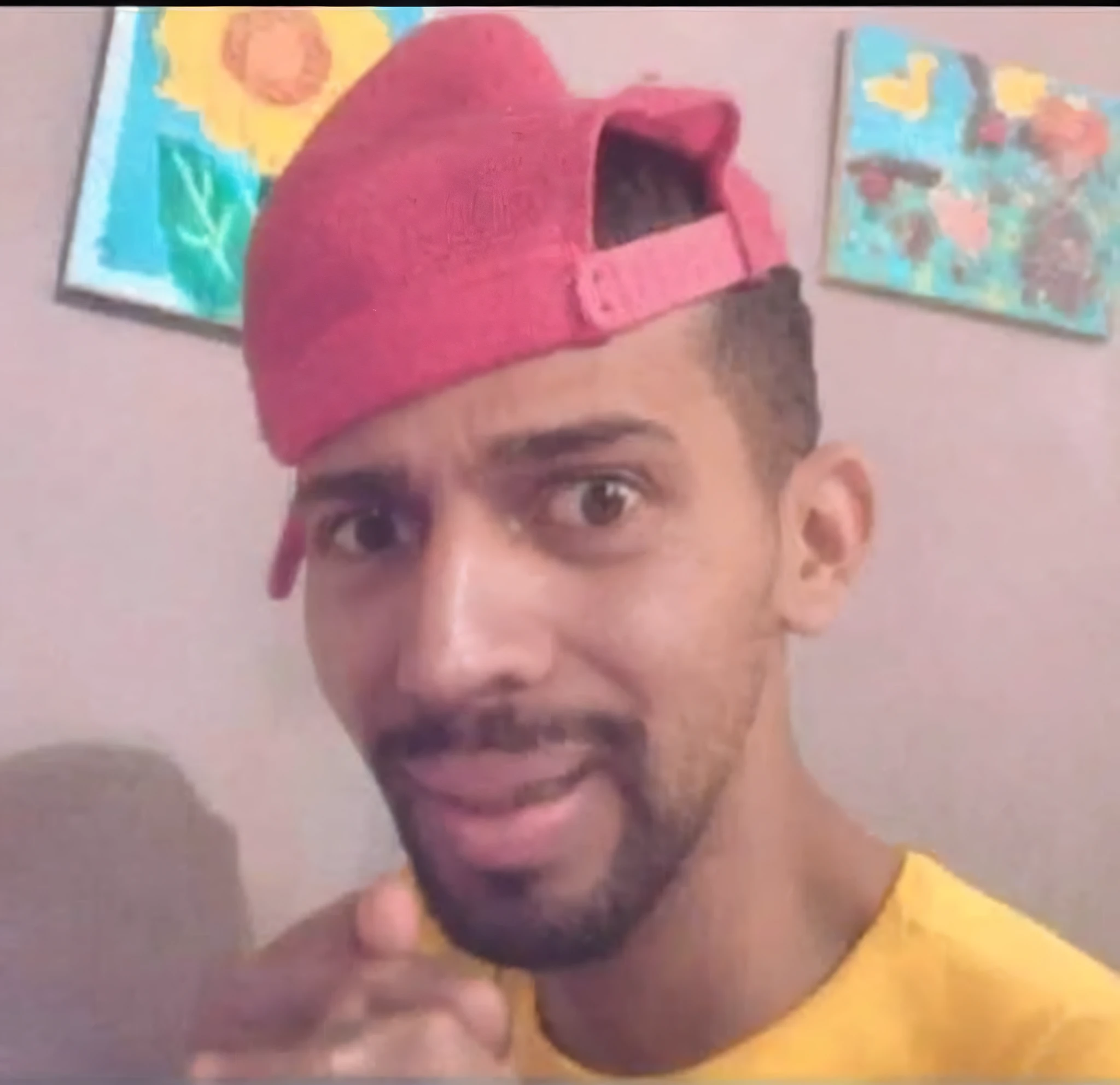 arafed man with a pink hat on his head and a yellow shirt, mohamed reda, profile pic, with rap cap on head, art masterpice, very very low quality picture, really funny, luis melo, masterpice, juanmao, profile picture, mohamed chahin, facebook post, profile photo, ronaldo luis nazario da lima