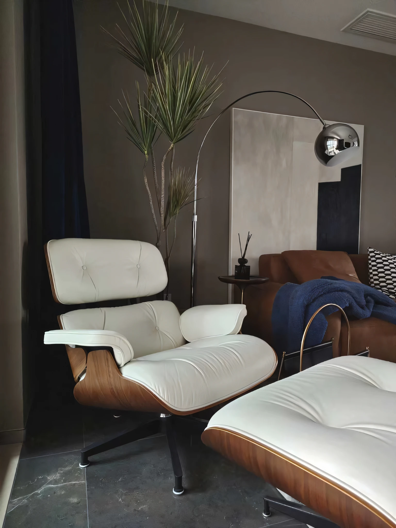 there is a white chair and a brown chair in a living room, inspired by Isamu Noguchi, placed in a large living room, with dramatic lighting, placed in a living room, mid-century modern furniture, sitting in a lounge, inspired by Willem Claeszoon Heda, relaxing environment, modernist interior, lounge room, clean and pristine design