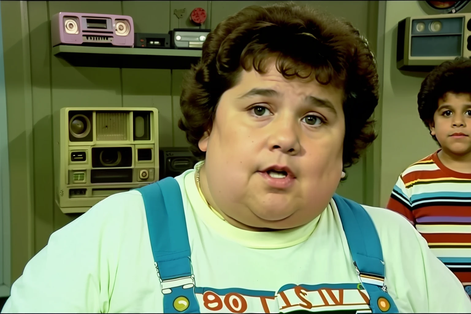 (((vhs screengrab, shot on a broadcast camera, a live-action 80’s sitcom))) featuring a boy (8 years old:1.3), (fat boy:1.3), green overalls, black straight hair, scene head diagonally, indoor house background. Reference: friends, Seinfeld, Full house.