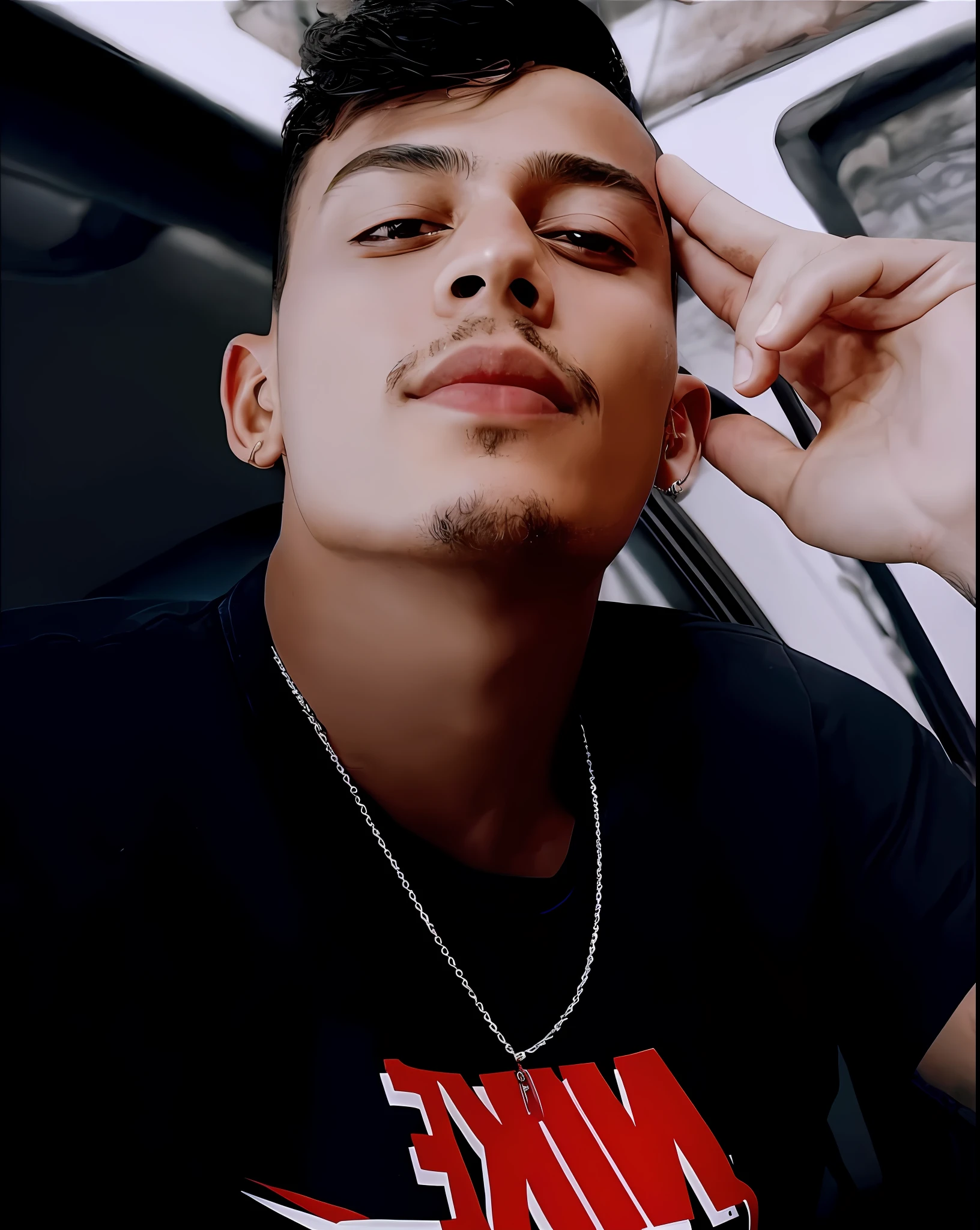 there is a man with a necklace on his neck and a black shirt, caio santos, mateus 9 5, andres rios, very very low quality picture, zigor samaniego style, instagram story, guapo, frontal picture, taken in the early 2020s, victor maristane, zigor samaniego, profile pic, low quality