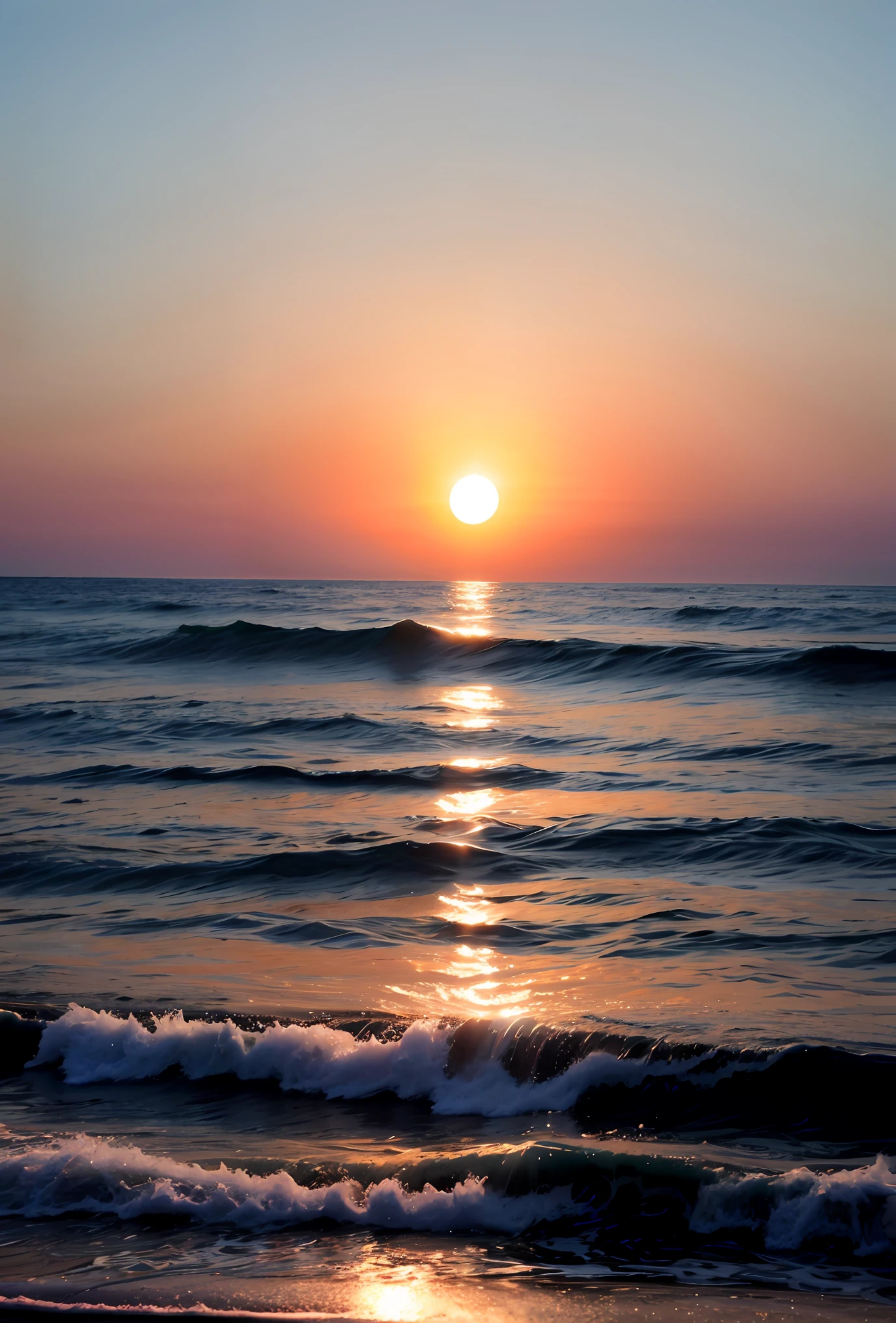 The sun sets and the sea is illuminated with a halo.