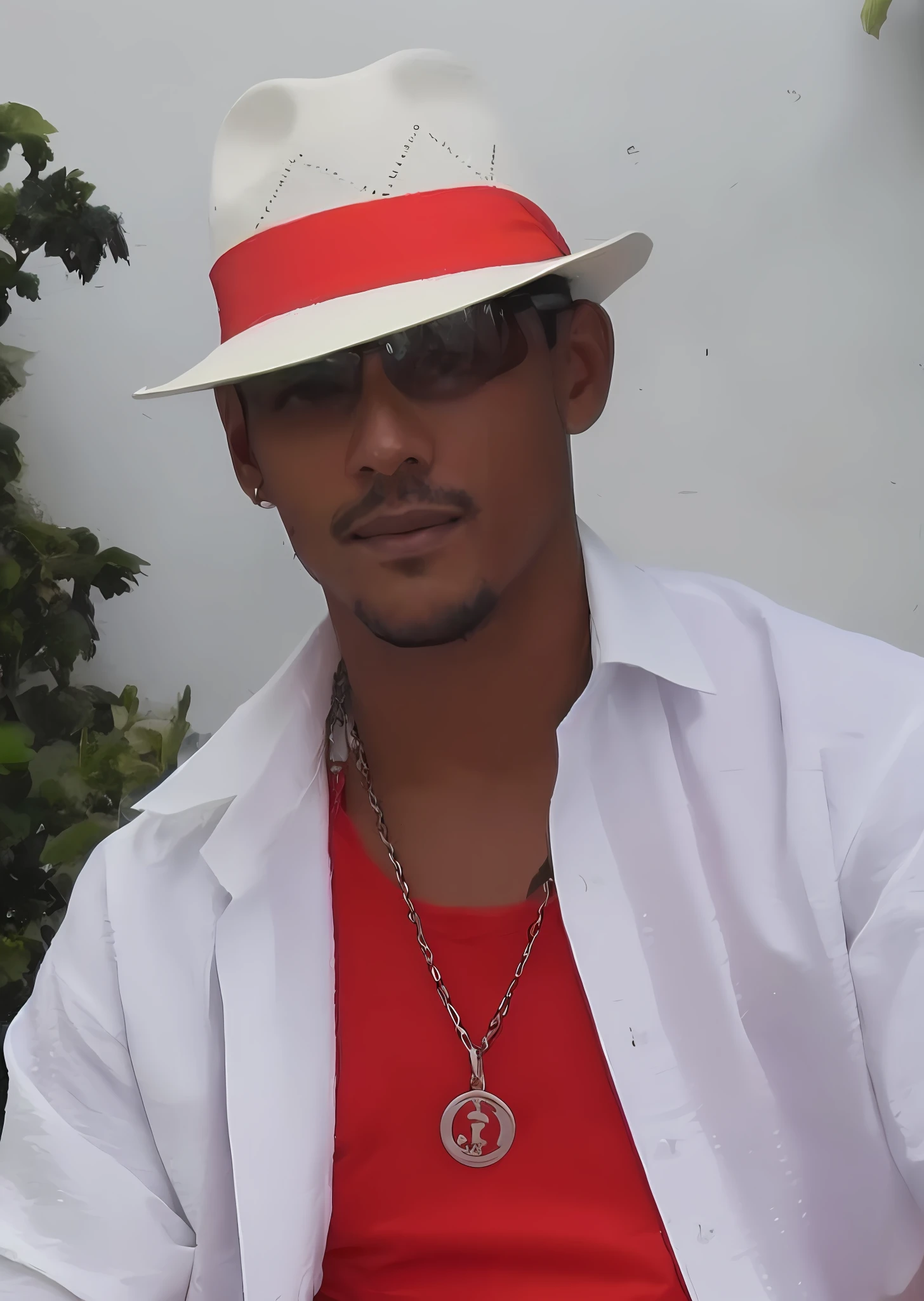A man in a white hat and red shirt,