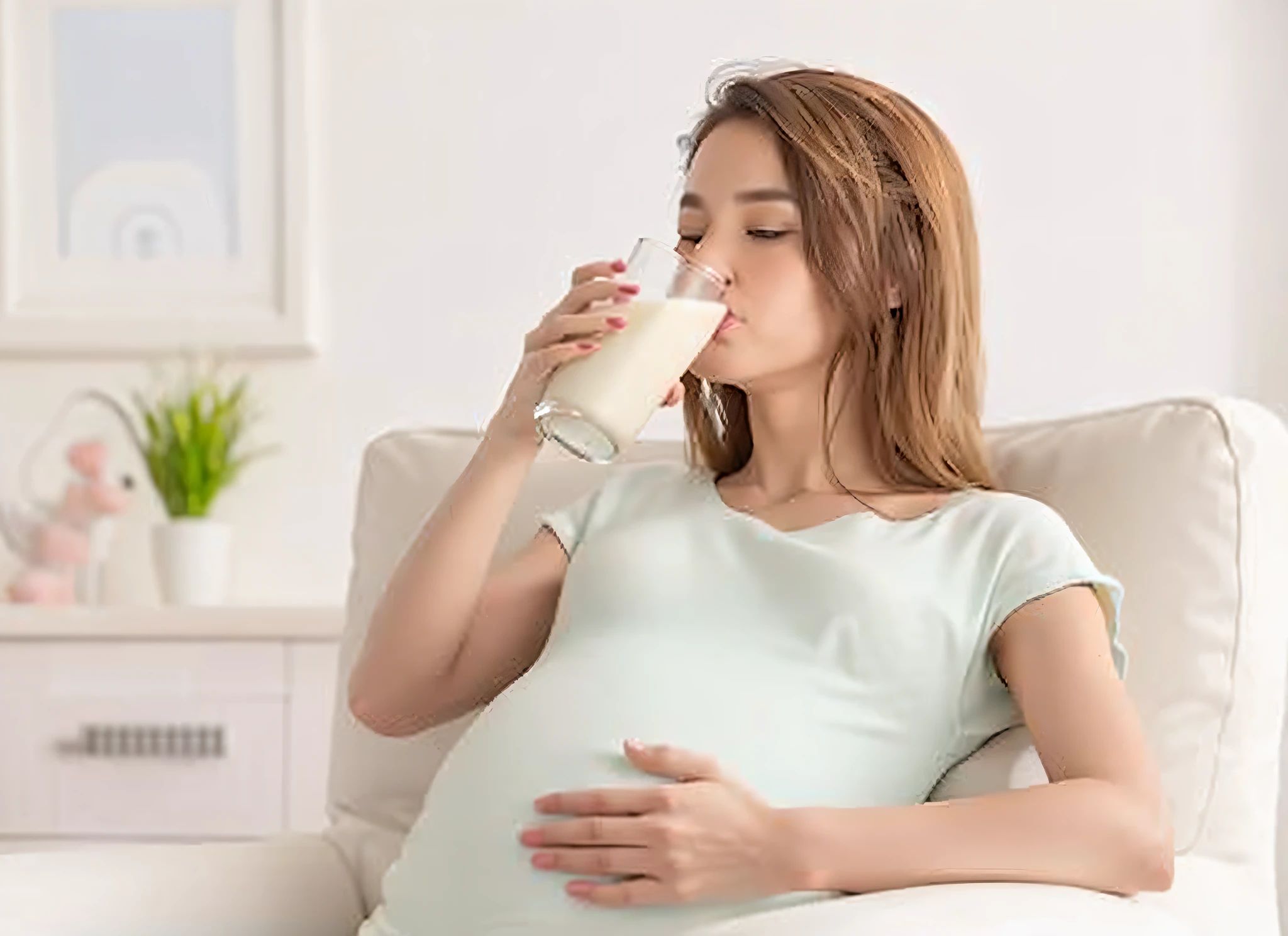 pregnant woman drinking milk from a glass while sitting on a couch, flowing milk, pregnancy, glass of milk, pregnant, holding a milkor mgl, sea of milk, milk dripping, milk - bath effect, drink milkshakes together, with a straw, milk, top milk brands, maternity feeling, pregnant belly, soey milk, drinking a strawberry iced latte --auto --s2