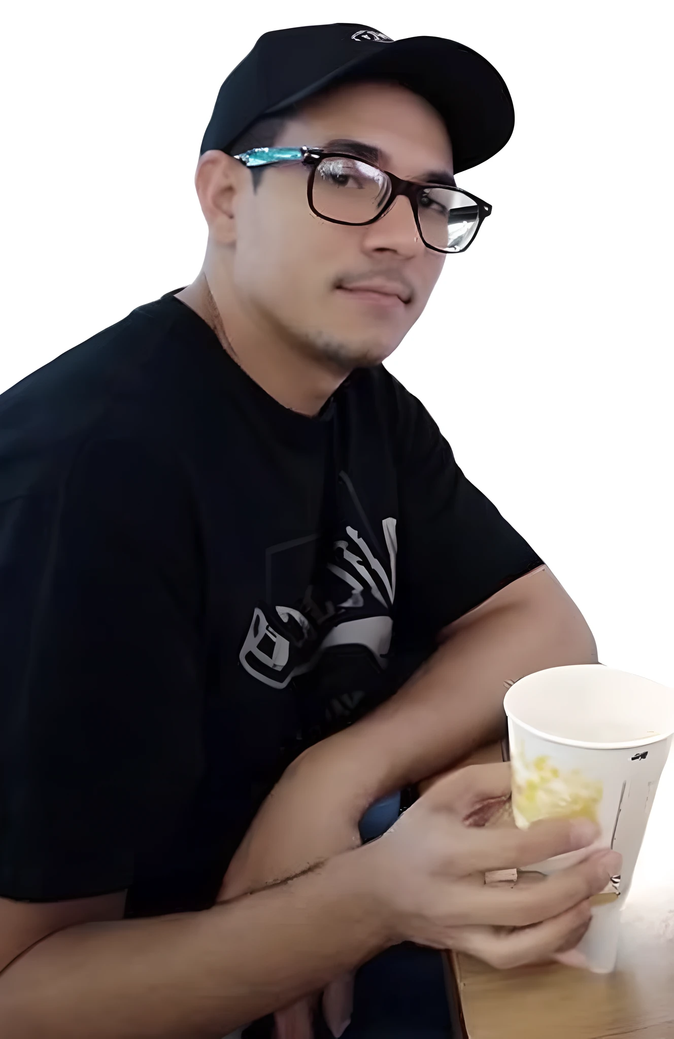 there is a man sitting at a table with a cup of coffee, very very low quality picture, taken in the early 2020s, andres rios, profile photo, typical cryptocurrency nerd, twitch streamer / gamer ludwig, david rios ferreira, avatar image, victor maristane, profile picture, profile pic, taken in the late 2010s