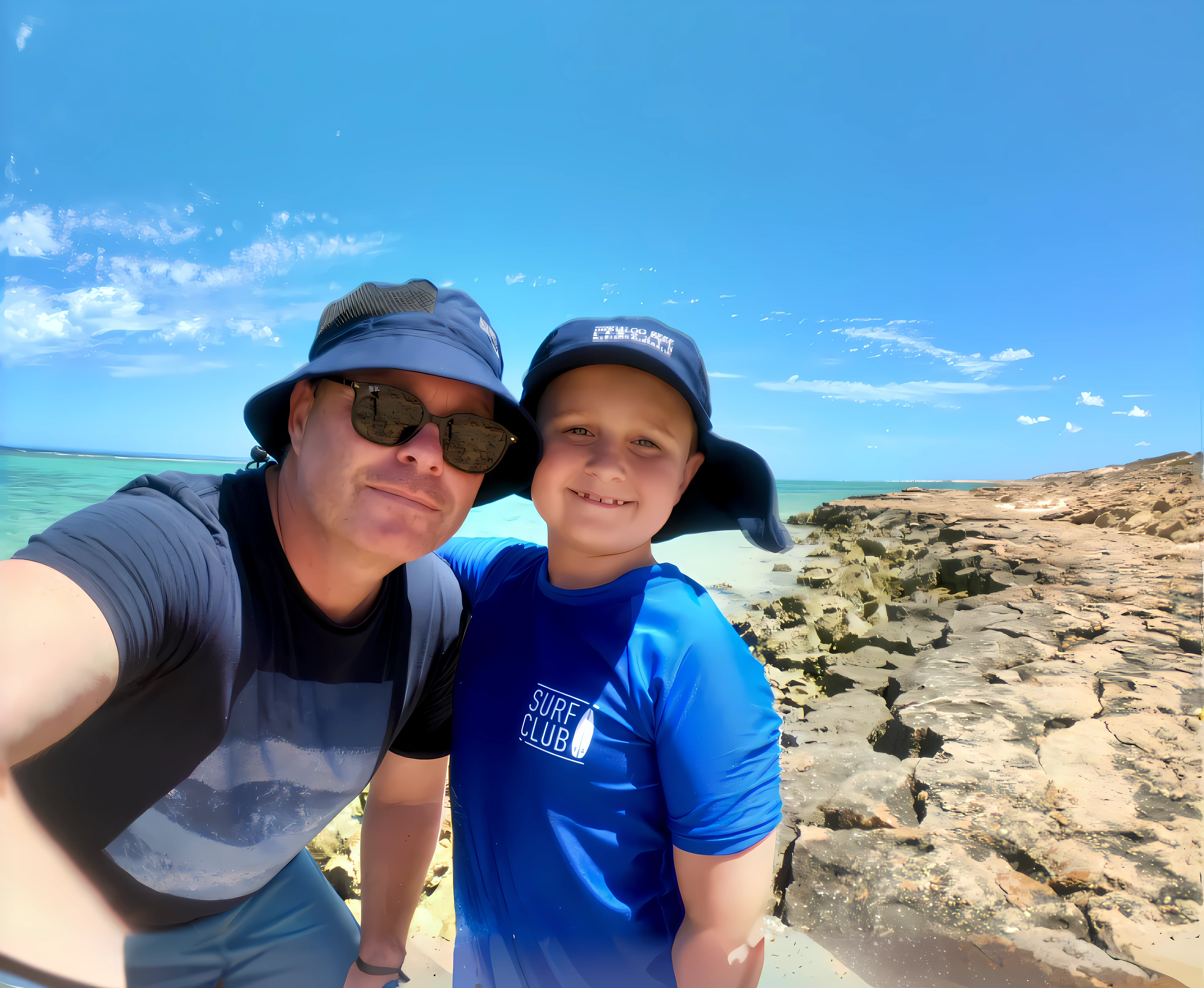 there is a man and a boy taking a selfie on the beach, taken on iphone 1 3 pro, standing near the beach, taken on iphone 14 pro, profile pic, myself, by Lee Loughridge, on a hot australian day, near the beach, taken on go pro hero8, wearing sunglasses and a cap, wearing sunglasses and a hat, vacation photo