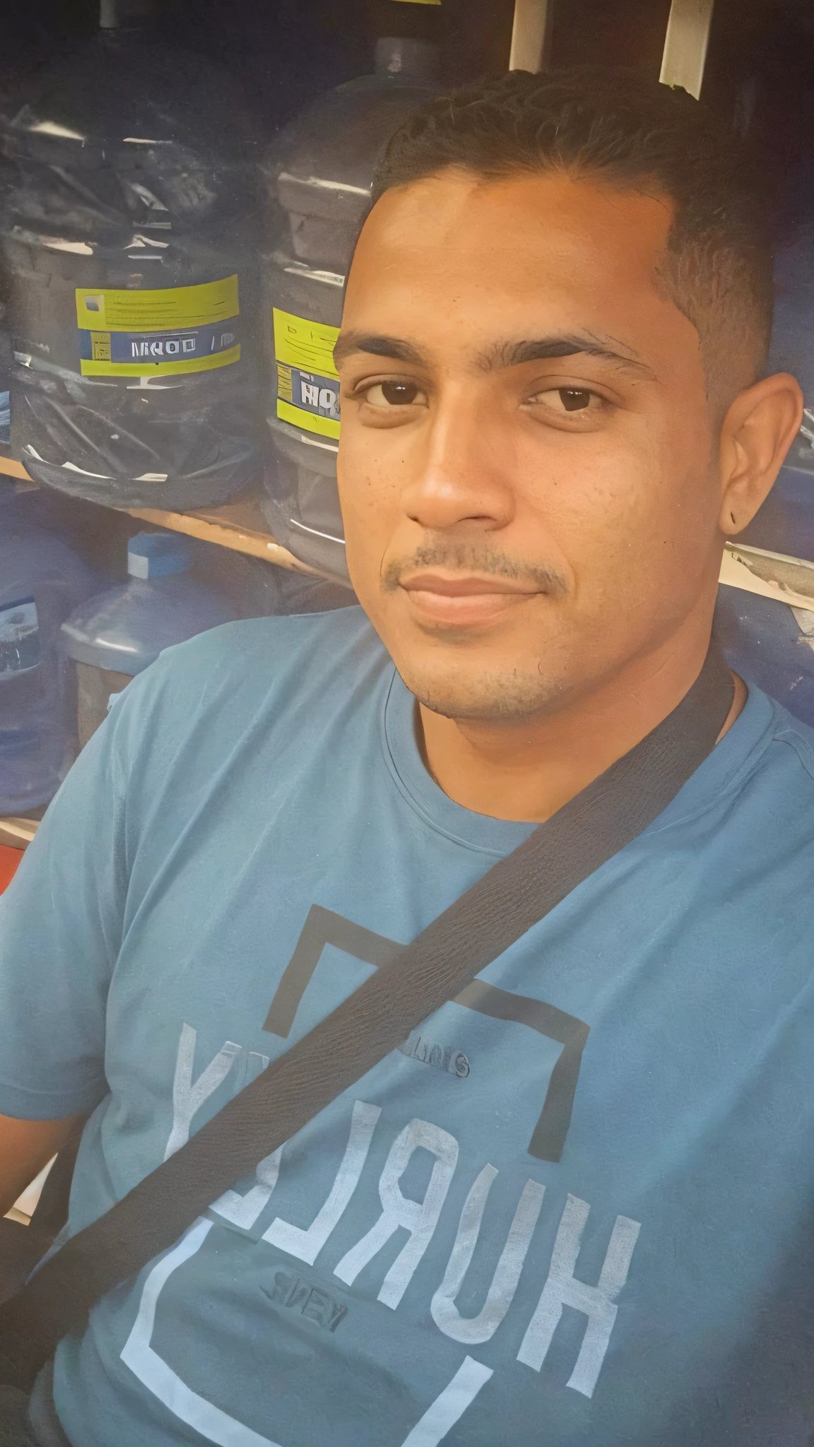 there is a man that is sitting in front of a shelf of water bottles, taken in the early 2020s, david rios ferreira, profile picture, very very low quality picture, mohamed chahin, profile image, about 3 s old, andres rios, victor maristane, around 1 9 year caio santos
