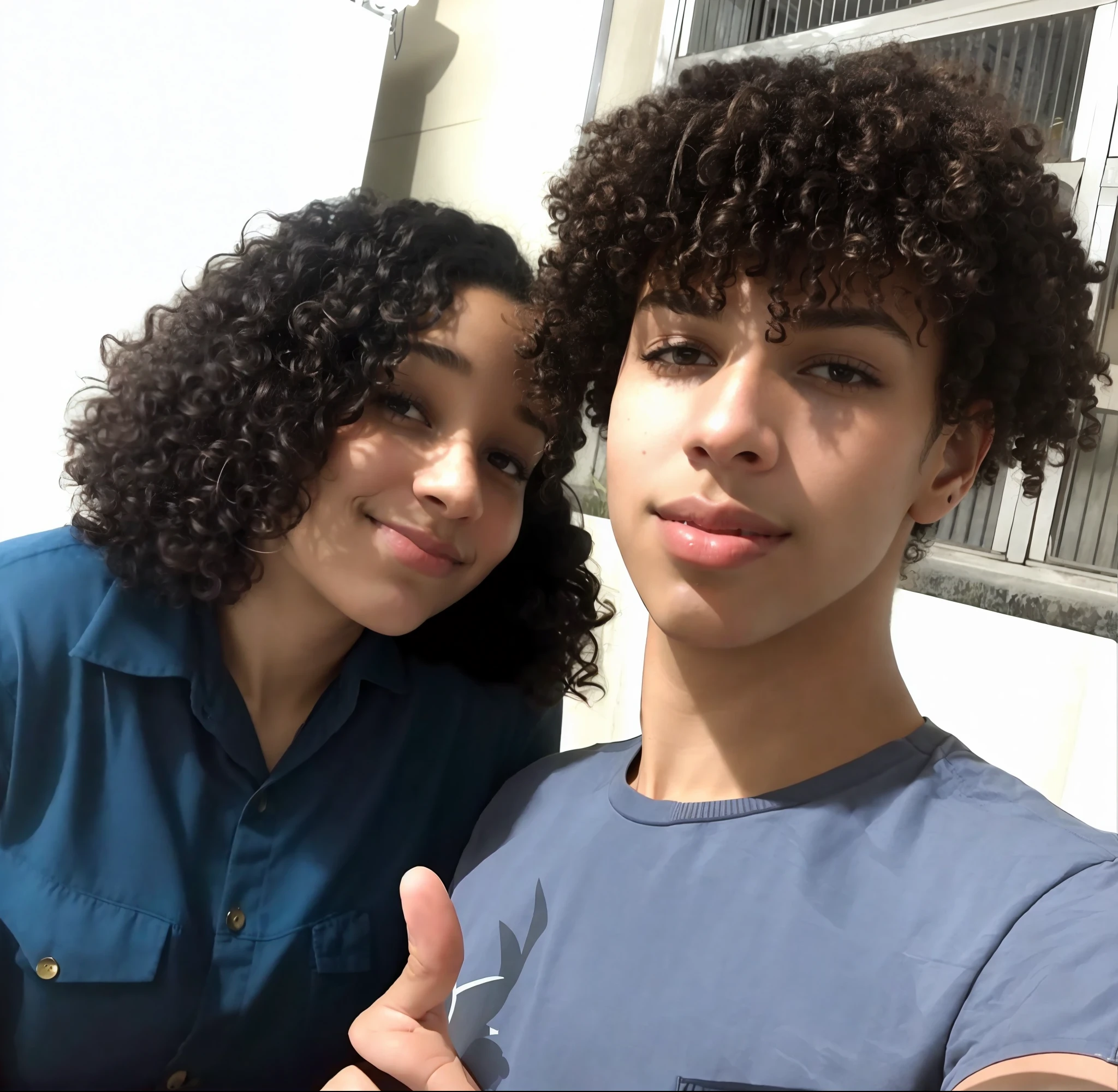 there is a man and woman that are posing for a picture, profile picture, he has short curly brown hair, curly and short top hair, with afro, high quality!!!!!, curly afro, headshot profile picture, profile pic, curly haired, curly middle part haircut, curls on top of his head, curls on top, profile image, profile photo