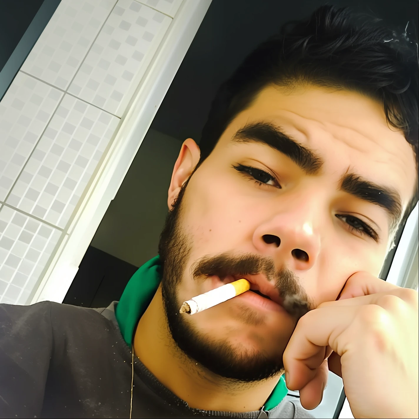 there is a man with a cigarette in his mouth and a cigarette in his mouth, with cigar, cigarette in his mouth, he is smoking a cigarette, around 1 9 , smoking a cigarrette🚬, with a cigarette in its mouth, while smoking a cigar, cigarette, caio santos, taking a smoke break, there is a cigar in his mouth