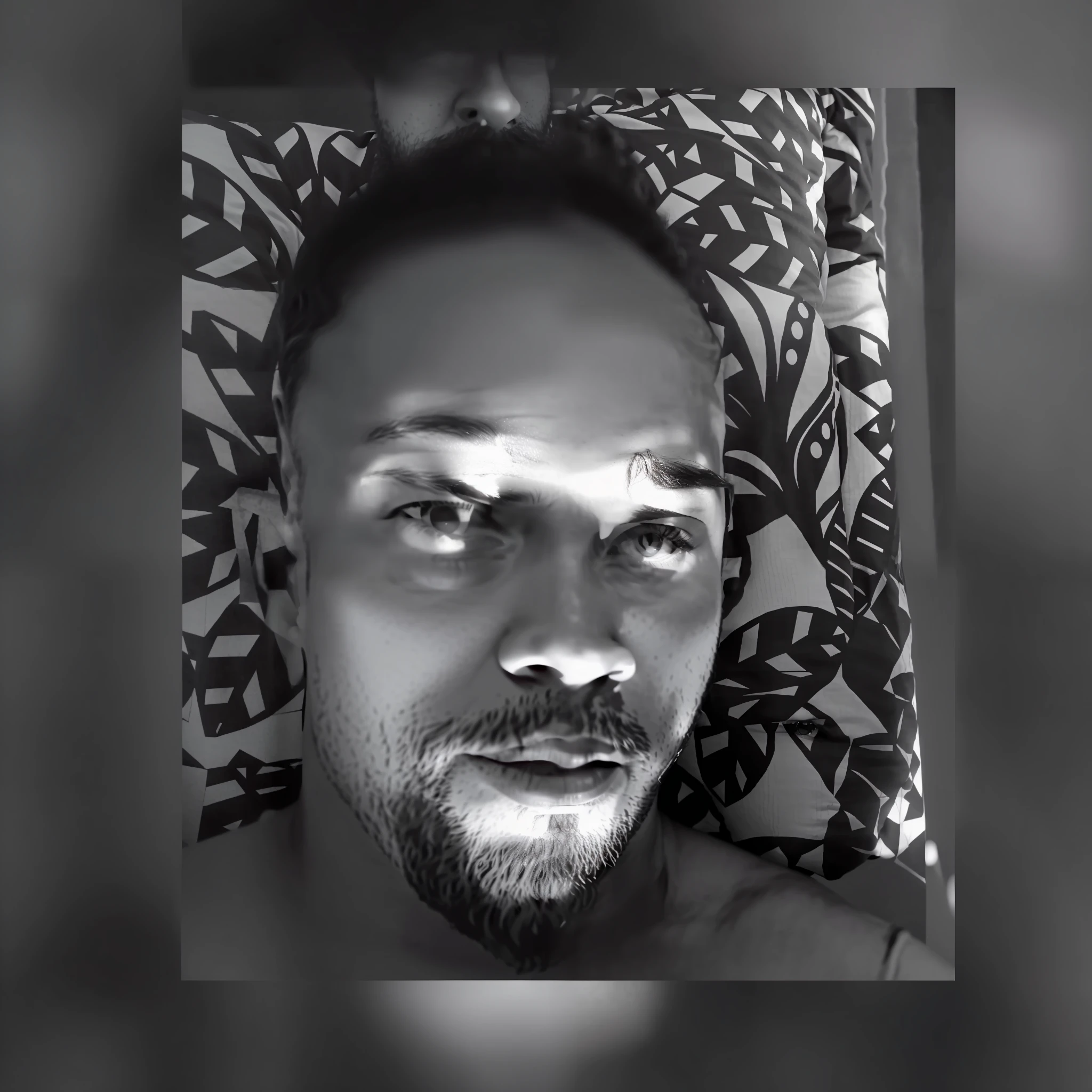 a black and white photo of a man with a beard, trending photo, taken in the early 2020s, black and white picture, laying down, a black and white photo, uploaded, african jesse pinkman portrait, “ sensual, b&w photo, leaked photo, snapchat photo, high quality upload, profile photo, looking towards the camera