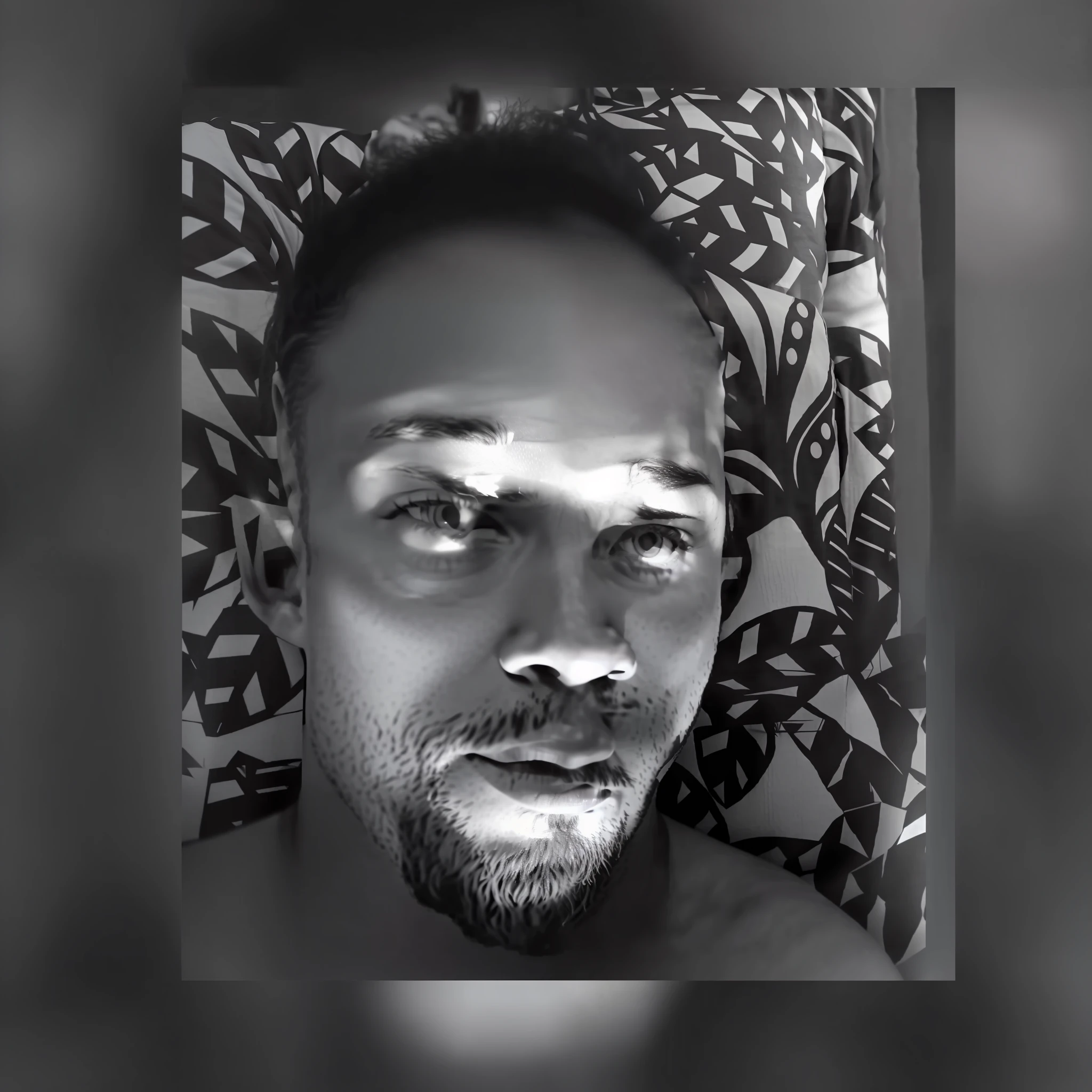 a black and white photo of a man with a beard, trending photo, taken in the early 2020s, black and white picture, laying down, a black and white photo, uploaded, african jesse pinkman portrait, “ sensual, b&w photo, leaked photo, snapchat photo, high quality upload, profile photo, looking towards the camera