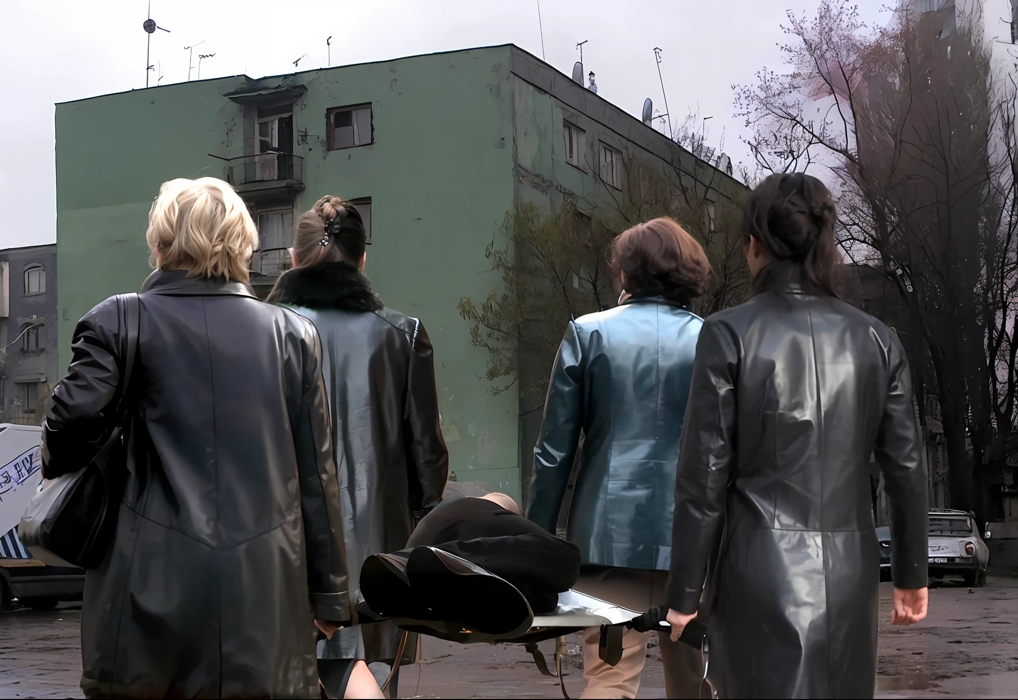 several longhaired women in shiny long leather coats are walking down a street while carrying a stretcher, an elderly man is been carried on a stretcher, women are carrying a man on a stretcher, women in shiny coats are carrying a stretcher in the street, dramatic pose, theatralic rescue pose, first aid scene, shiny clothed women in a rainy street, a writhing man is lying on a stretcher, a stretcher in a russian demolished street, , photo still of behind view, dead bodies in the background, rear-shot, in postapocalypse city, video still, still from a music video, scene from the film, still from a movie, shot from movie, still from the film, still from l'estate, opening scene