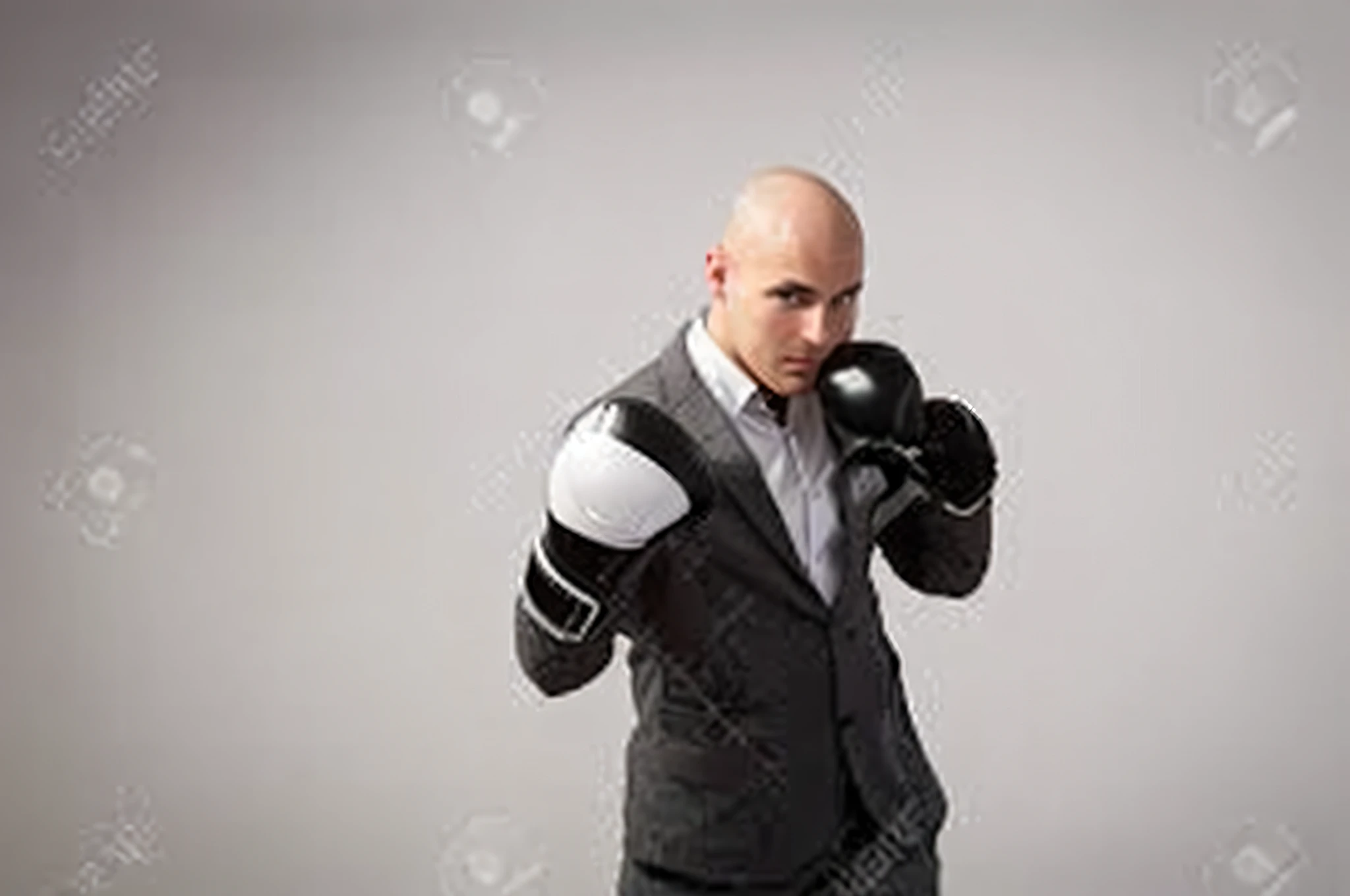 a BALD WHITE MAN in a boxing suit and gloves is posing for the camera, in a fighting posture, in a fight pose, boxing posture, posing ready for a fight, preparing to fight,