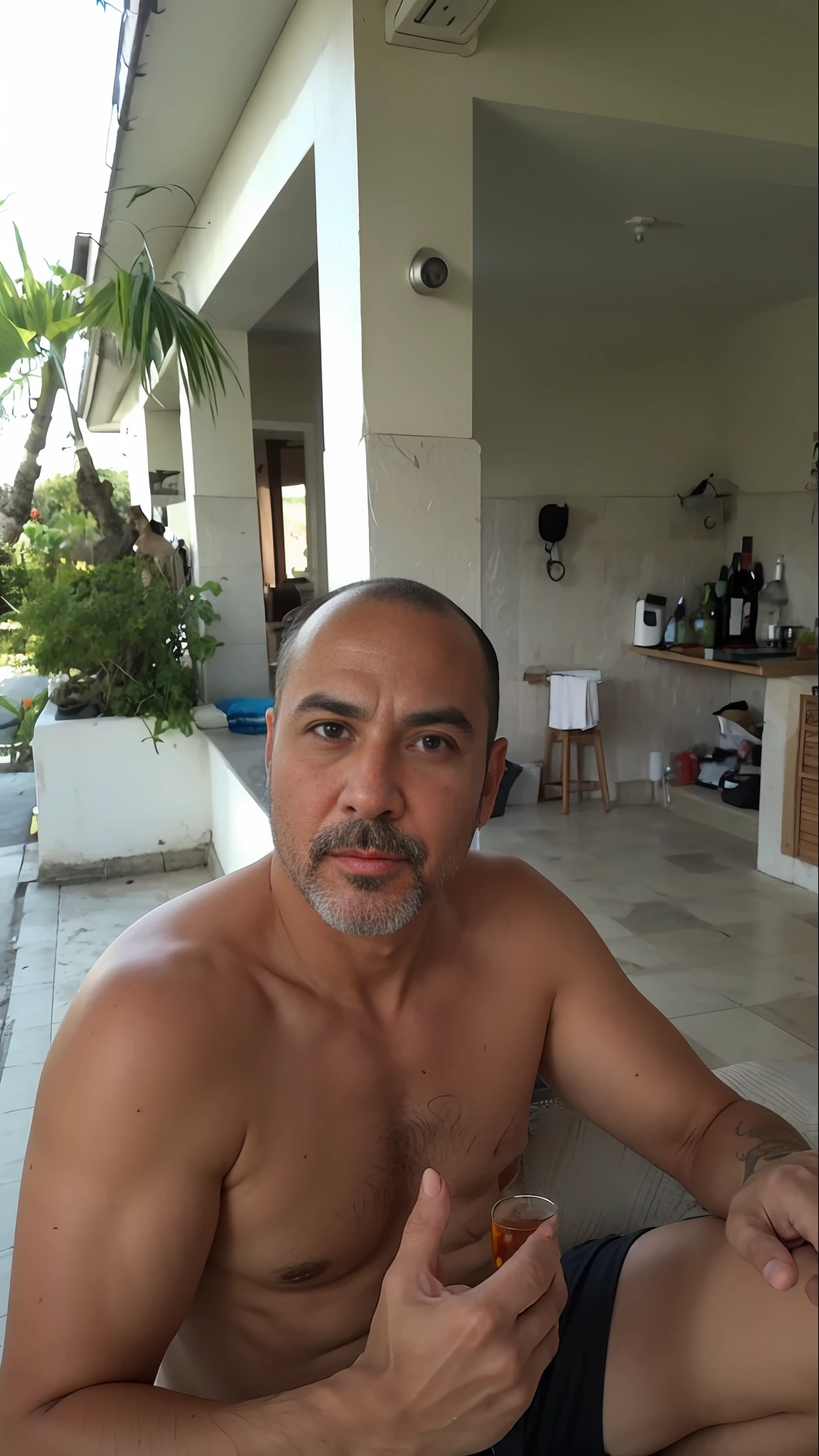 there is a man sitting on a porch with a drink in his hand, 4 0 years old man, 4 0 years old man, 40 years old men, 4 0 yo, fotografia de perfil, Bali, caneca : :, fotografia selfie, imagem do avatar, barbeado limpo!!!!, Carregado, david rios ferreira, fotografia, 4 0 yo, Davi A, barbeado limpo