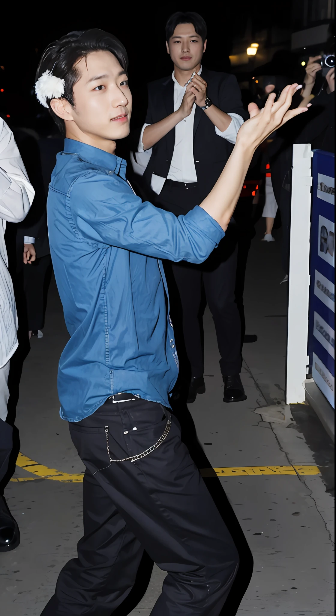 A man dancing, paparazzi, low quality