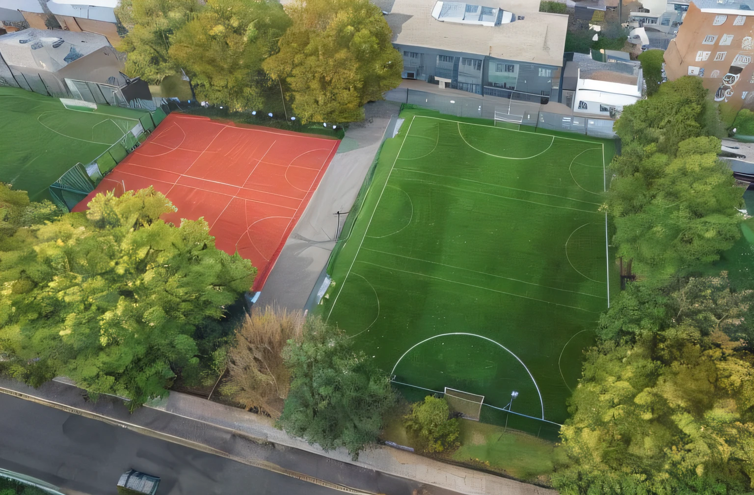 aerial view of a soccer field with a red and green field, photo taken from above, an aerial tennis court, aerial shot, high aerial shot, shot from above, aerial view from above, arial shot, photograph from above, wide aerial shot, ariel view, viewed from bird's-eye, seen from above, view from above, shot from drone, photo from above