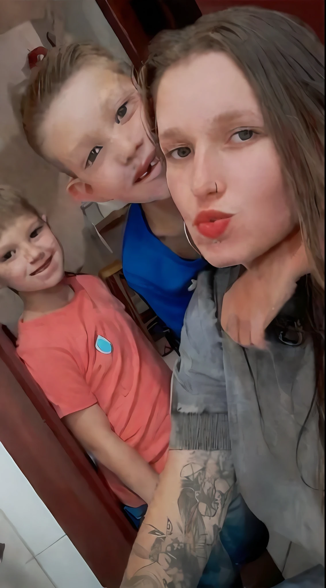 It's three kids who are taking a selfie in the mirror, great quality photo, taken in 2022, very silly looking, Dasha Taran, 1 6 , very accurate photo, taken in early 2020, are siblings,