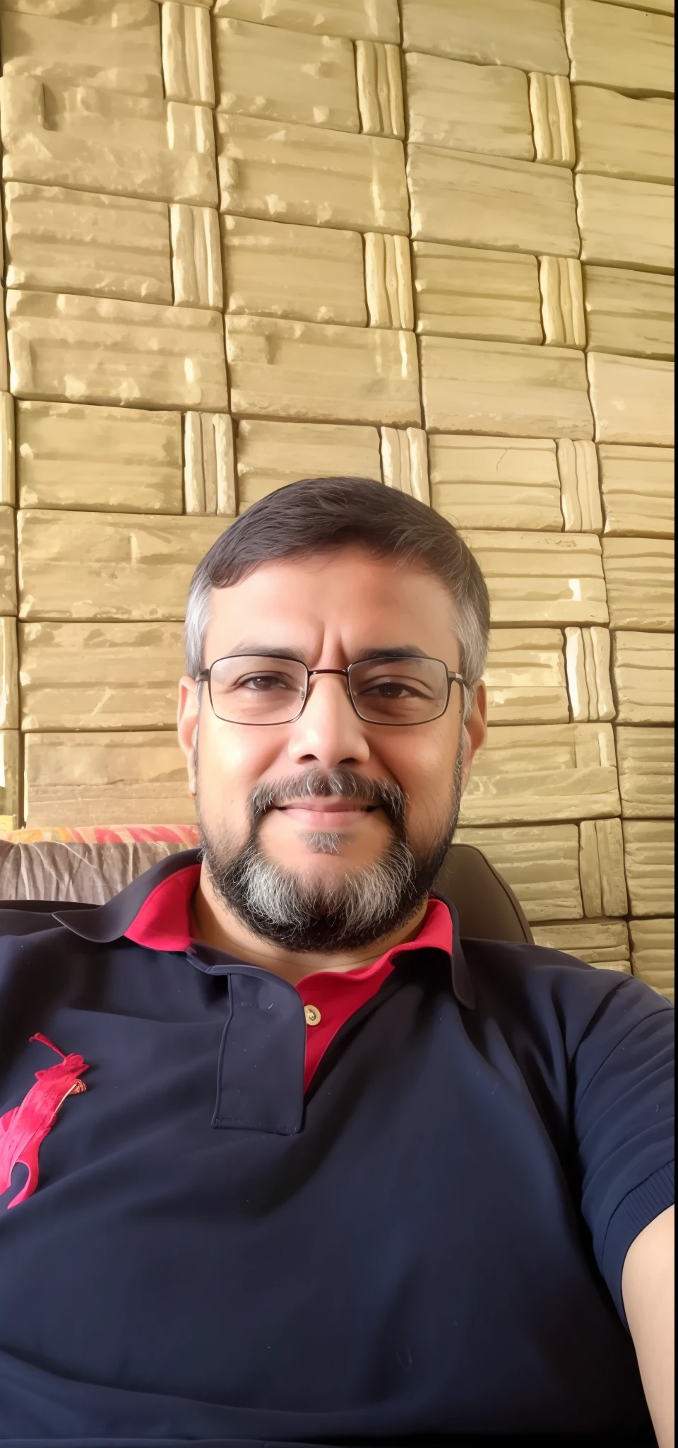 arafed man sitting on a couch with a remote control in his hand, inspired by Narayan Shridhar Bendre, ranjit ghosh, inspired by Bikash Bhattacharjee, by Rajesh Soni, emad mostaque, inspired by Sudip Roy, selfie photo, mohamed chahin, sayem reza, photo taken with sony a7r camera