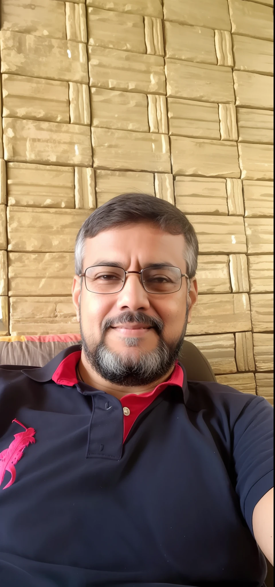 arafed man sitting on a couch with a remote control in his hand, inspired by Narayan Shridhar Bendre, ranjit ghosh, inspired by Bikash Bhattacharjee, by Rajesh Soni, emad mostaque, inspired by Sudip Roy, selfie photo, mohamed chahin, sayem reza, photo taken with sony a7r camera