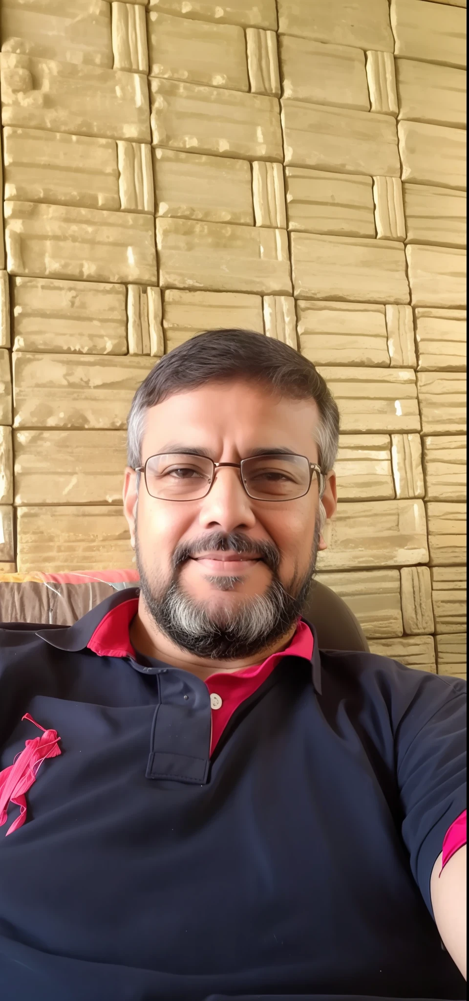 arafed man sitting on a couch with a remote control in his hand, inspired by Narayan Shridhar Bendre, ranjit ghosh, inspired by Bikash Bhattacharjee, by Rajesh Soni, emad mostaque, inspired by Sudip Roy, selfie photo, mohamed chahin, sayem reza, photo taken with sony a7r camera