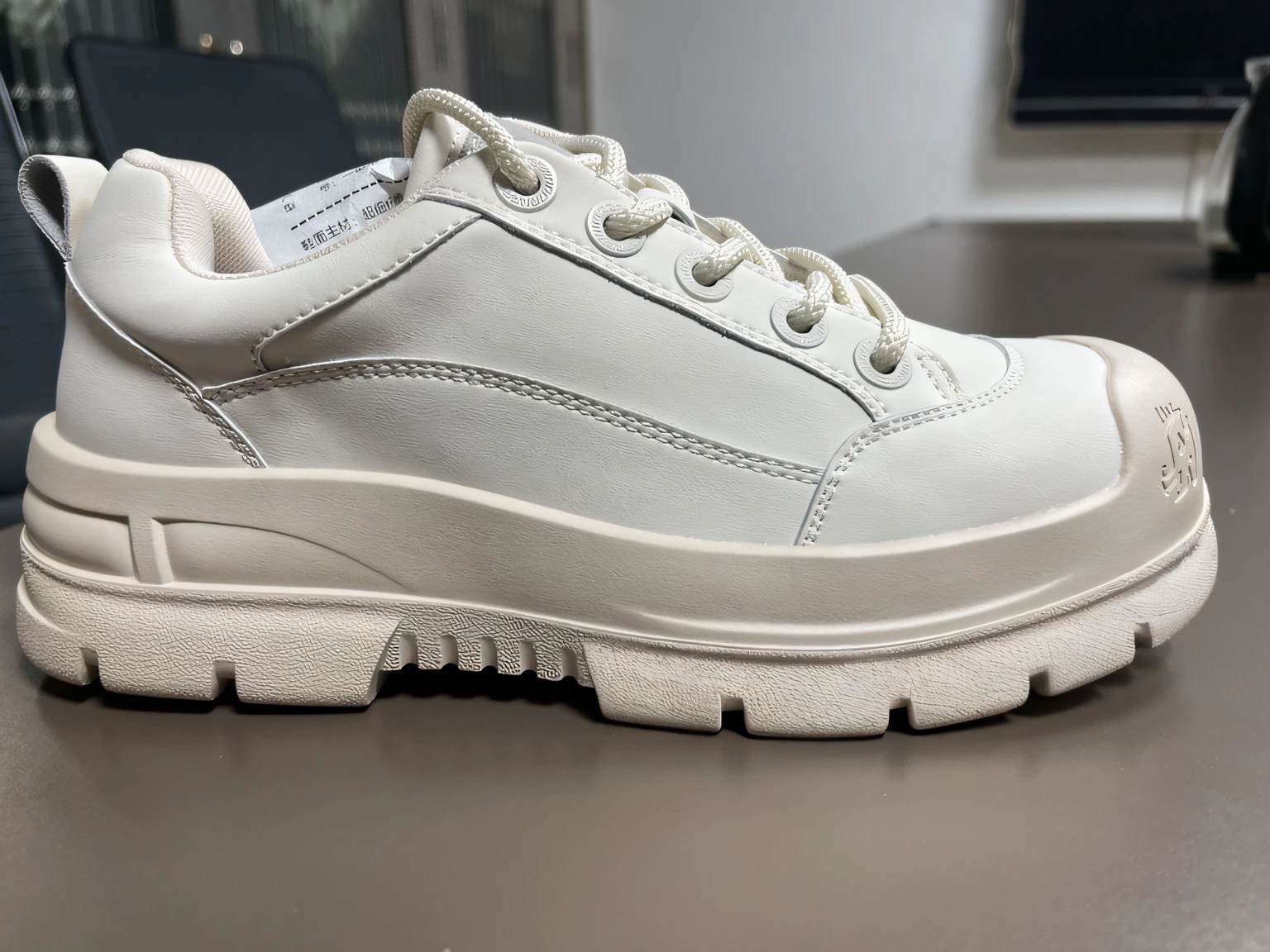 a close up of a white shoe on a table with a computer, front side views full, whole shoe is in picture, white shoes, white soft leather model, 2 0 2 0, 2020, triple white colorway, gum rubber outsole, focus on sneakers only, sneaker design, 2021, 2 0 2 1