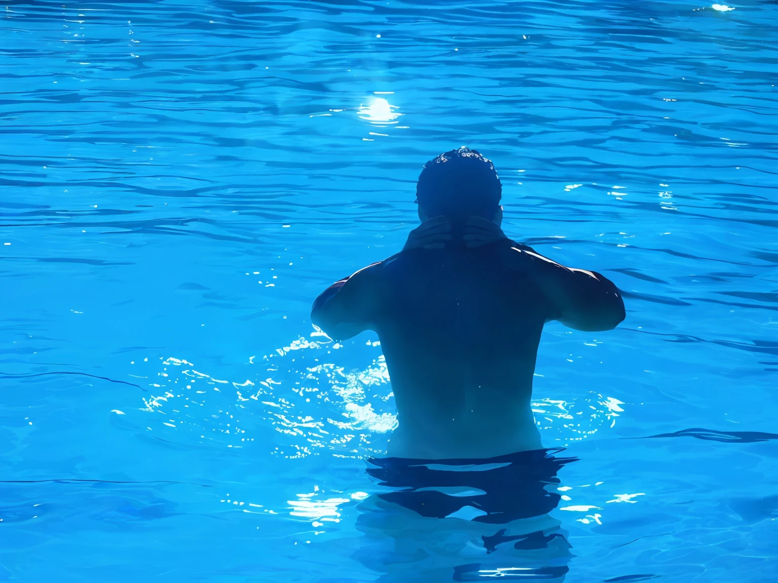 Man in pool with emerald green water --auto