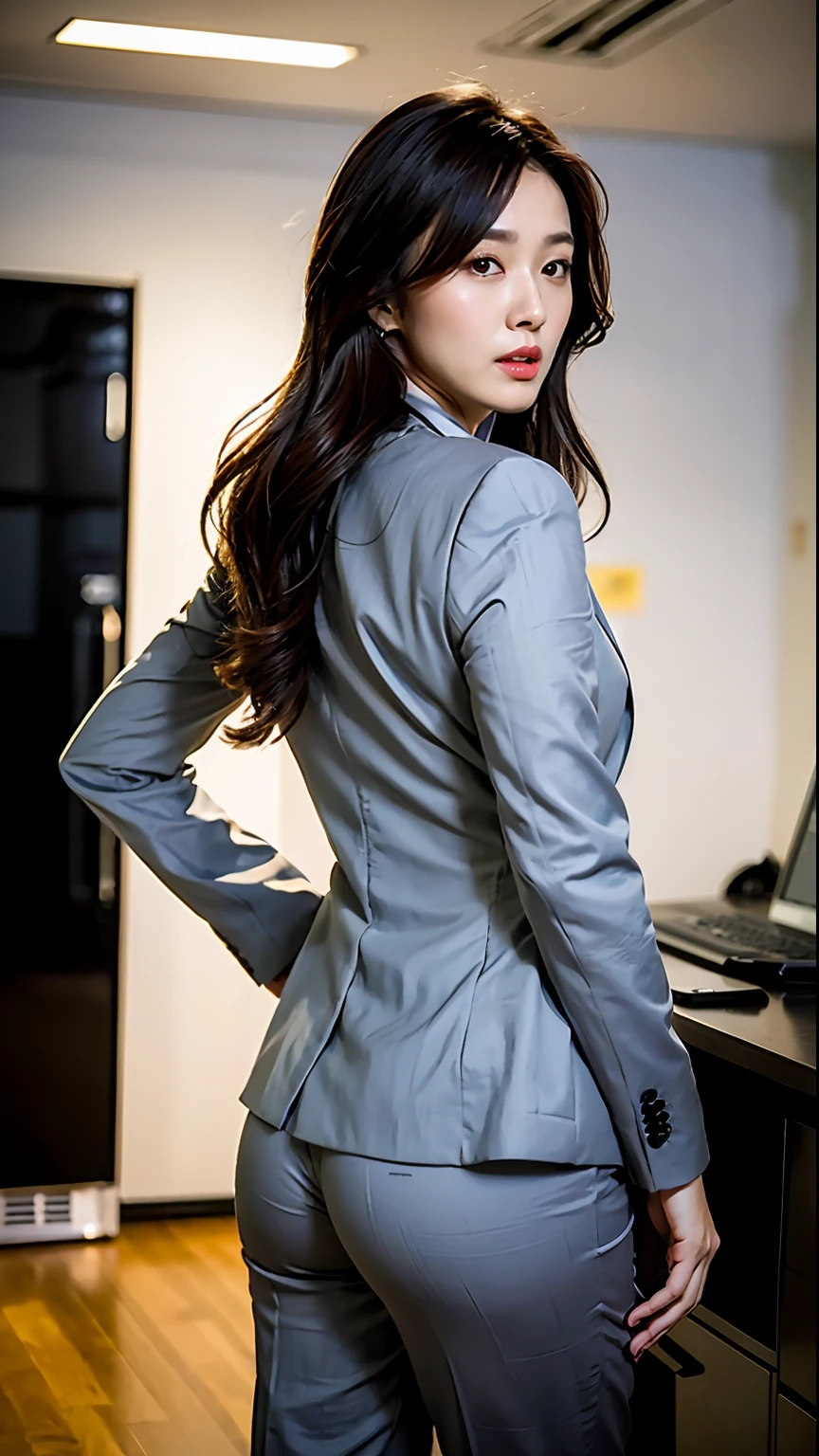 (Best Quality, 8k, 32k, Masterpiece, UHD: 1.2), 1 girl, beautiful asian woman, narrow waist, gray suit, open jacket, office lady, suit, pants, from the back, office, desk, (sticking out hips: 1.2), detailed face, long hair,