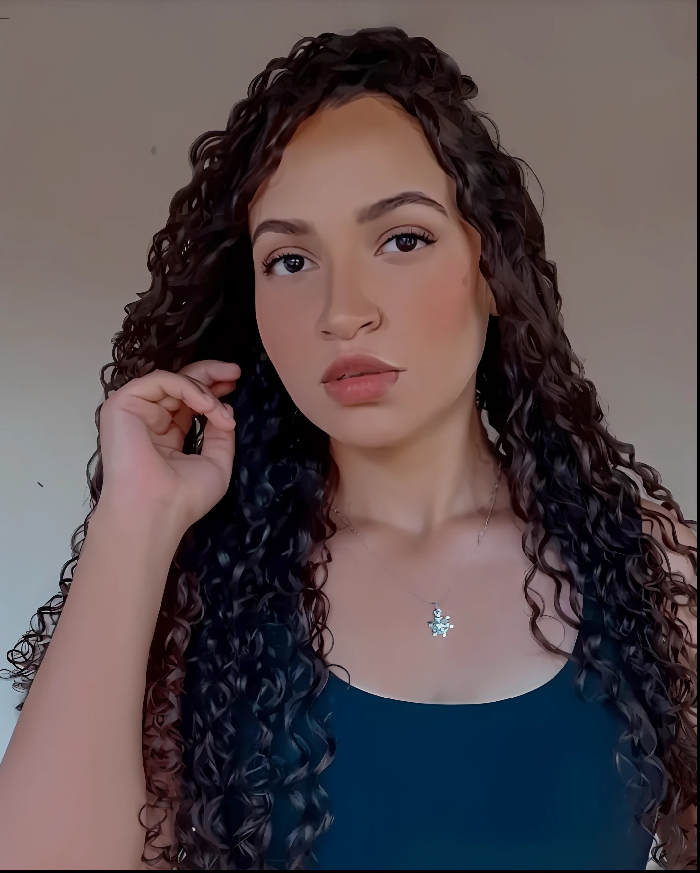 a close up of a woman with long curly hair wearing a blue top, with long curly hair, curly haired, long curly hair, with long curly, brown curly hair, 30-year-old woman from cuba, curly long hair, curly, long dark curly hair, curly hair, long curly brown hair, curly brown hair, light skin, with curls