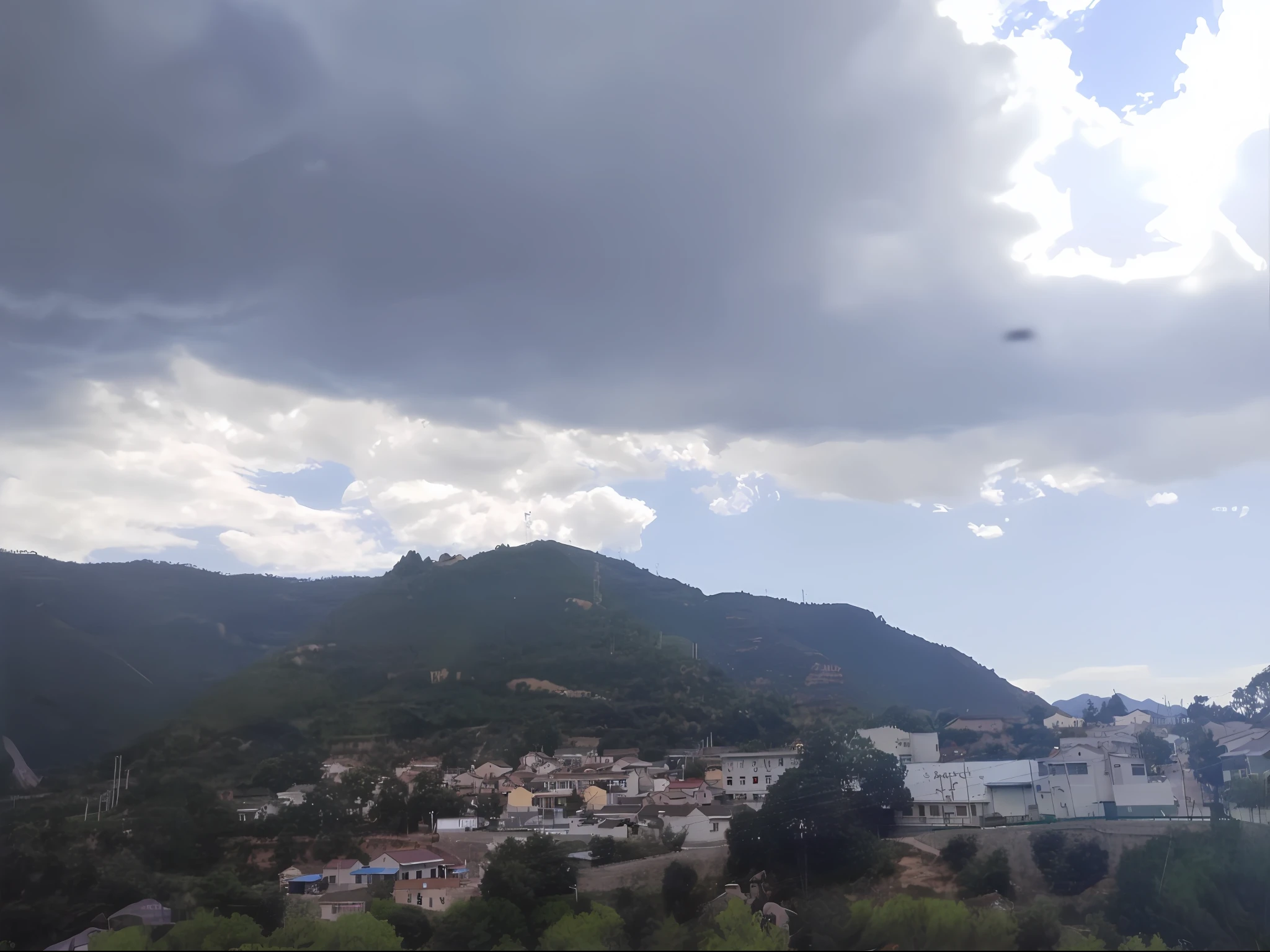 there is a train that is going down the tracks in the mountains, moutain in background, overcast day, town in the background, village in the background, in the foreground a small town, dark overcast weather, gloomy weather. High quality, mountain in background, hills in the background, mountain in background, Faraway view, overcast day, seen from the side
