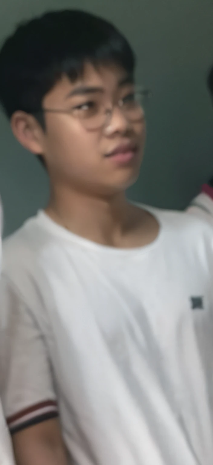 Two boys stood side by side,Hold the Wii controller, 1 6 years old, 18 years old, around 1 9 years old, very very low quality picture, 2 3 years old, 2 2 years old, blurry image, 2 7 years old, 1 7 - - old thin face, tommy 1 6 years old, thawan duchanee