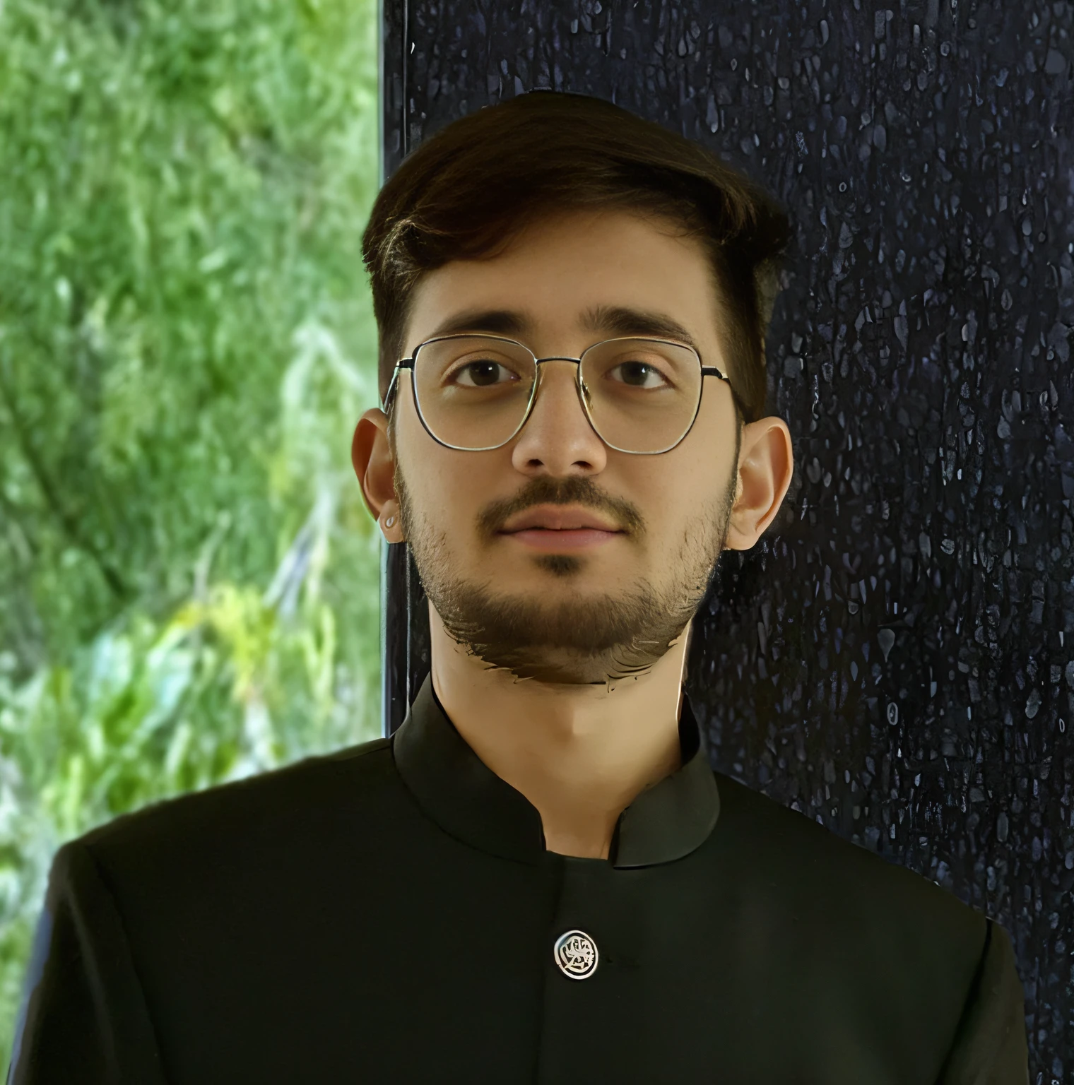 arafed man in a black jacket and glasses standing in front of a window, mid shot portrait, portait photo profile picture, with smiley face and densed beard,close - up portrait shot --auto