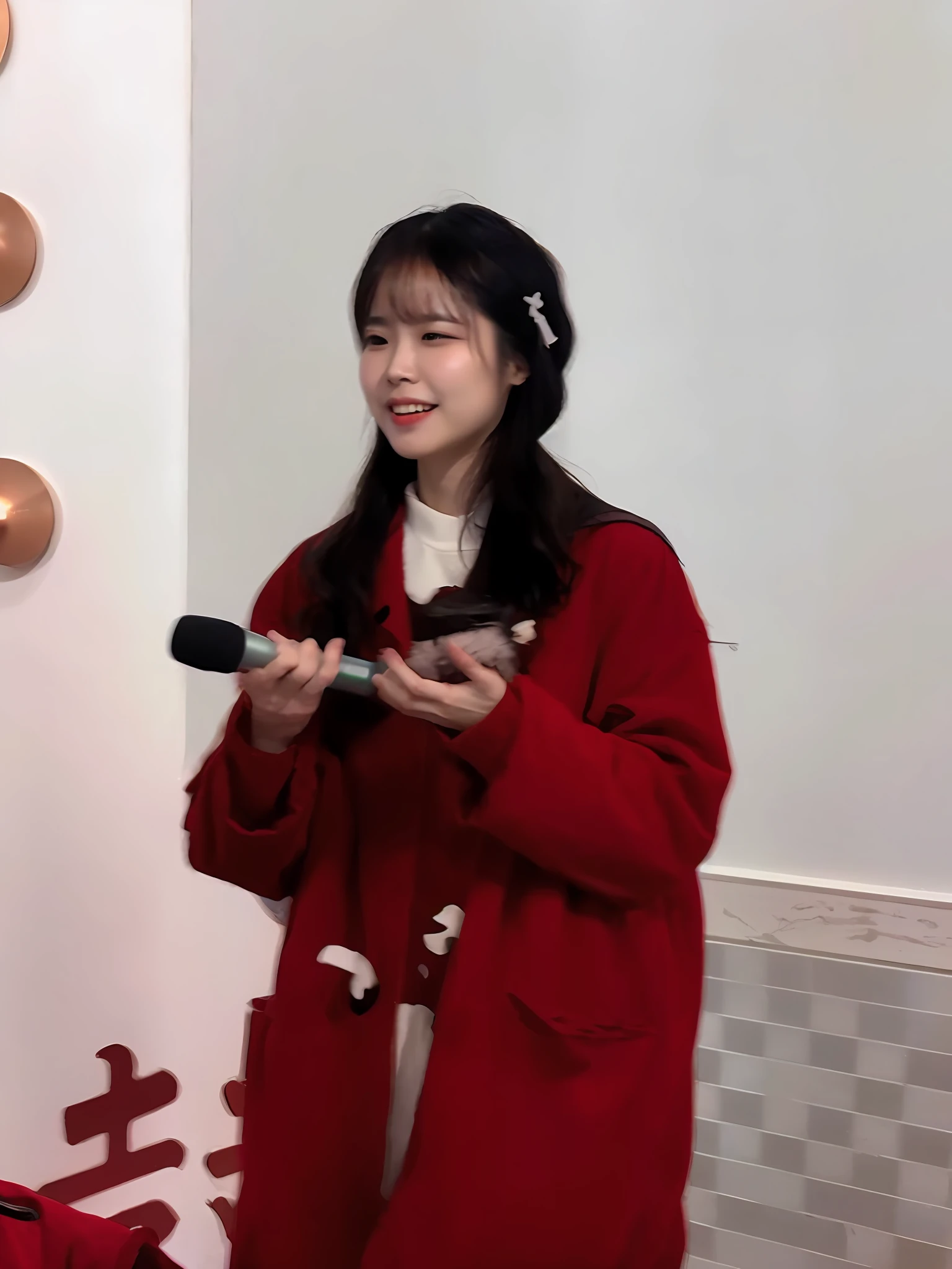 Woman in red coat standing in front of the wall with microphone, full-body xianxia, xintong chen, Li Zixin, shaxi, gongbi, wearing red jacket, appearing in a shopping mall, very very low quality, she expressing joy, Zhang Wanting, Xianxia, zmonzheng, Gemma Chen, chinese artist