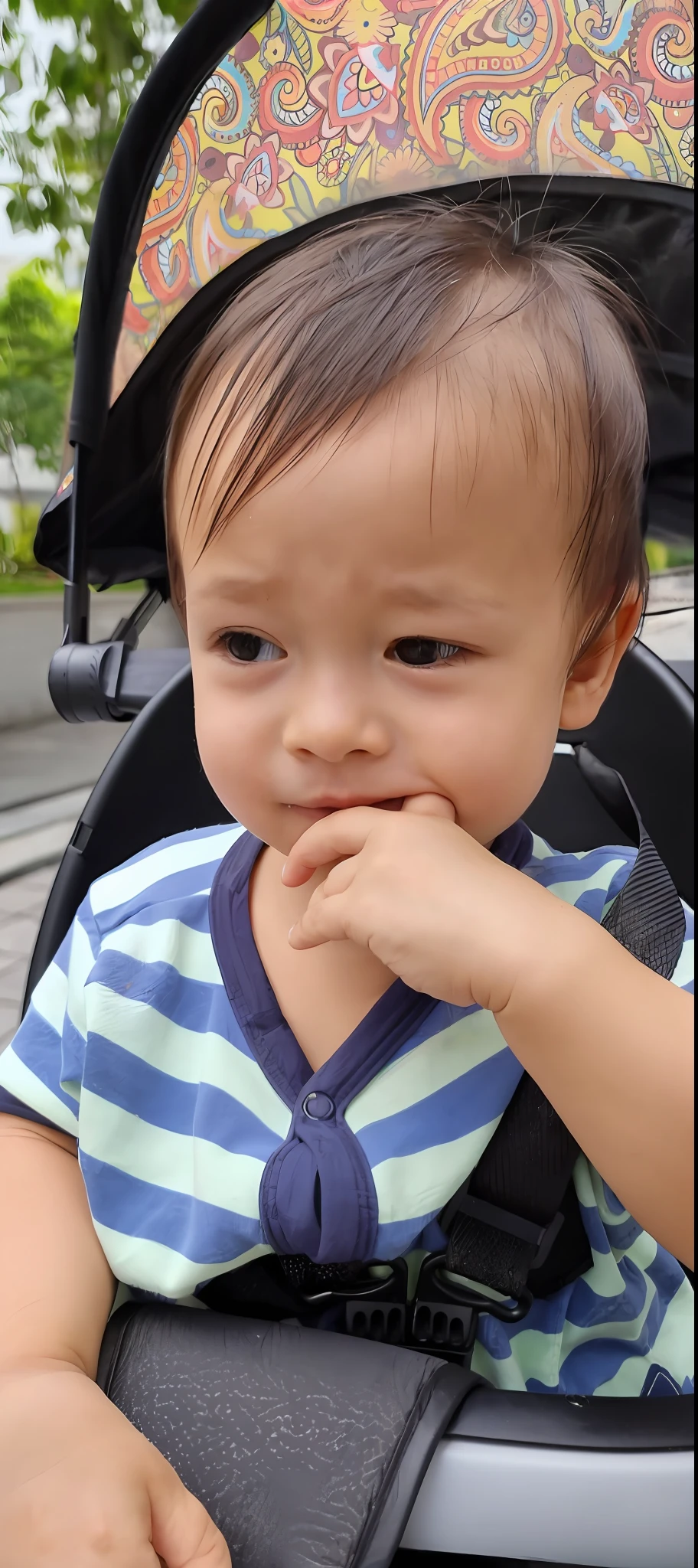 arafed  in a stroller with a colorful umbrella, hand on his cheek, hand on cheek, thoughtful expression, pouty face, concerned expression, mischievous expression, deep in thought, intense expression, pouting, serious expression, bashful expression, with a pouting smile, close up potrait, with serious face expression, sad expression